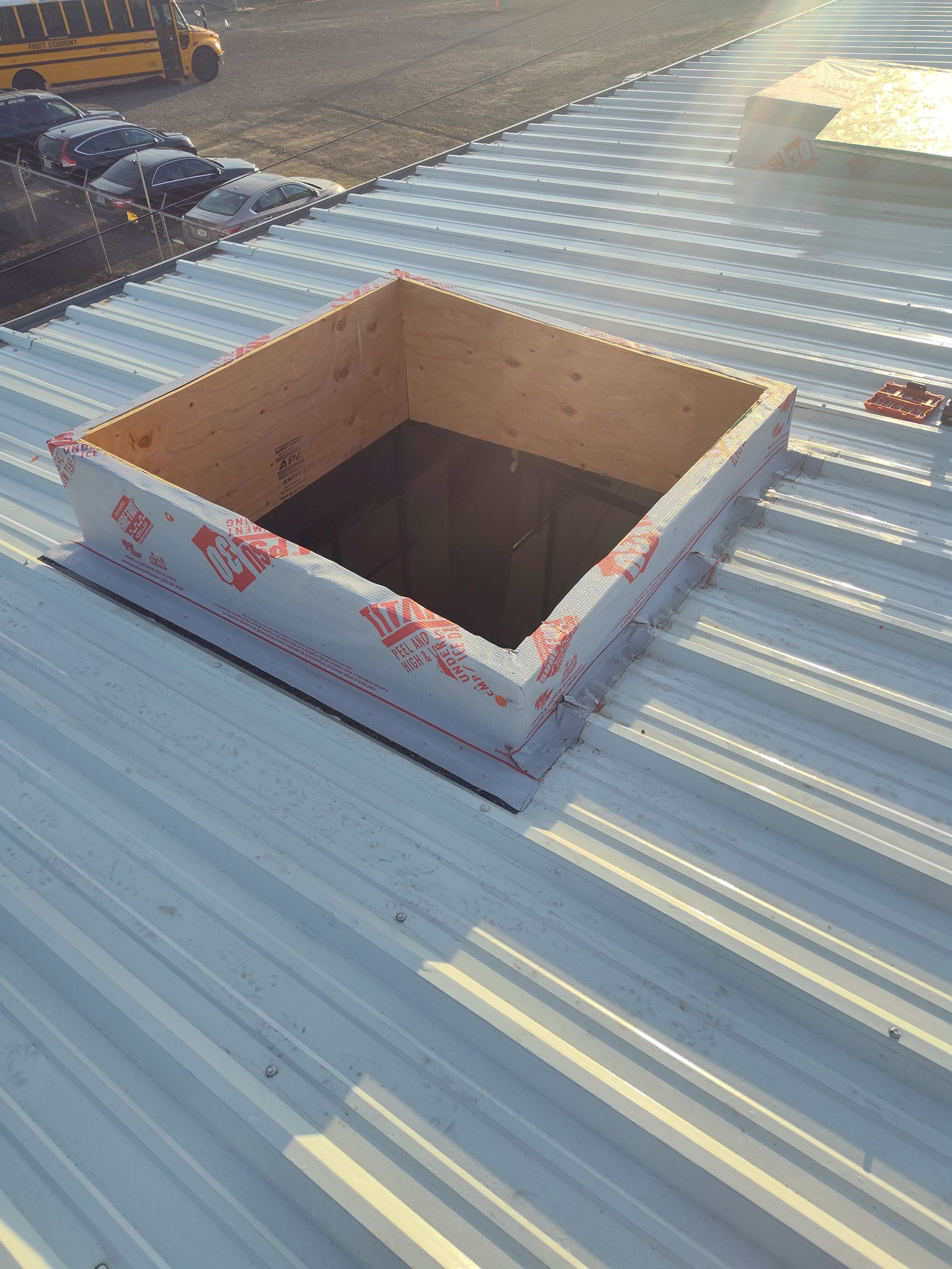 Installing New Curbs on a Metal Roof for new equipment by BEST Roofing & Waterproofing