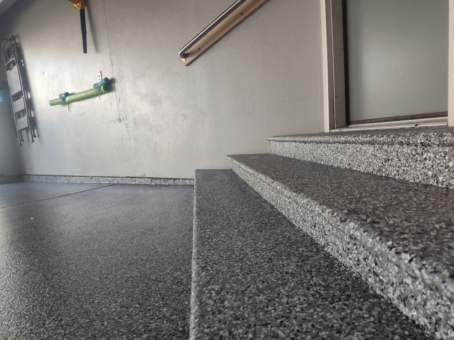 Close Up View of This Customer's New Flake Coating by Revival Concrete Coatings