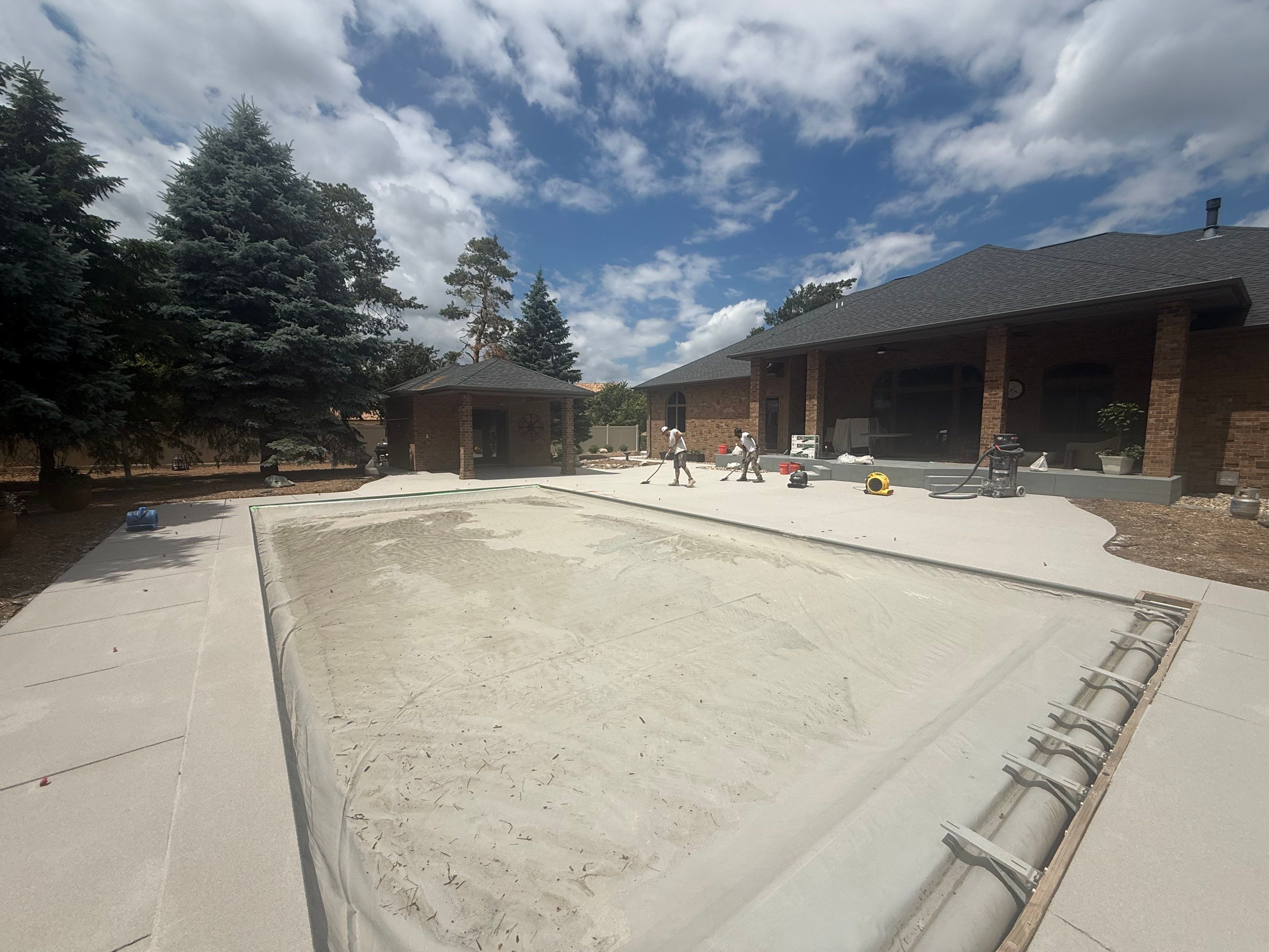 Decorative Concrete Pool Deck and Patio Resurfacing in Sioux Falls by Select Painting, Coatings & Garage Cabinets