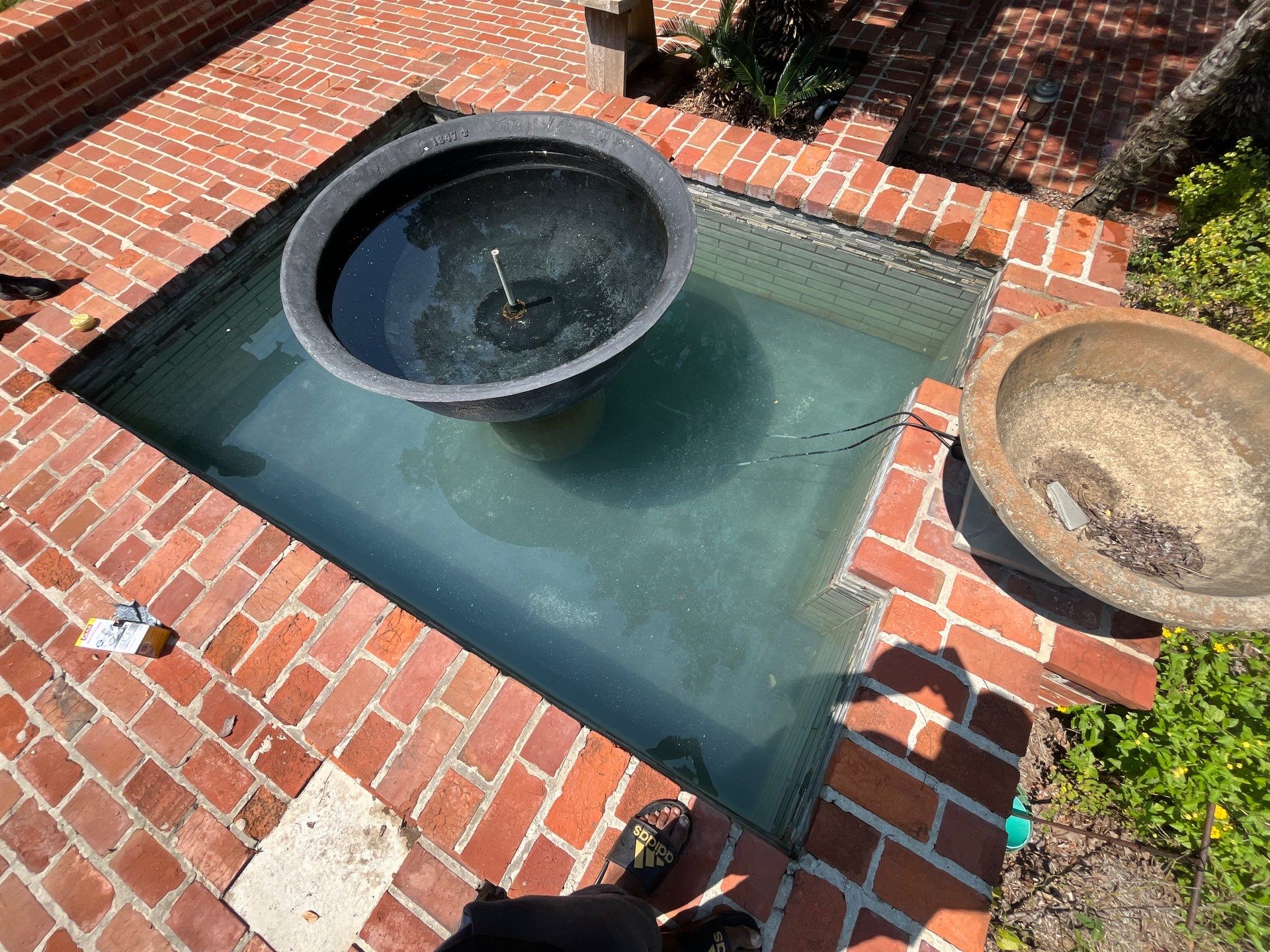 Pool Cleaning using Pool Cleaner by College Bros Outdoor services