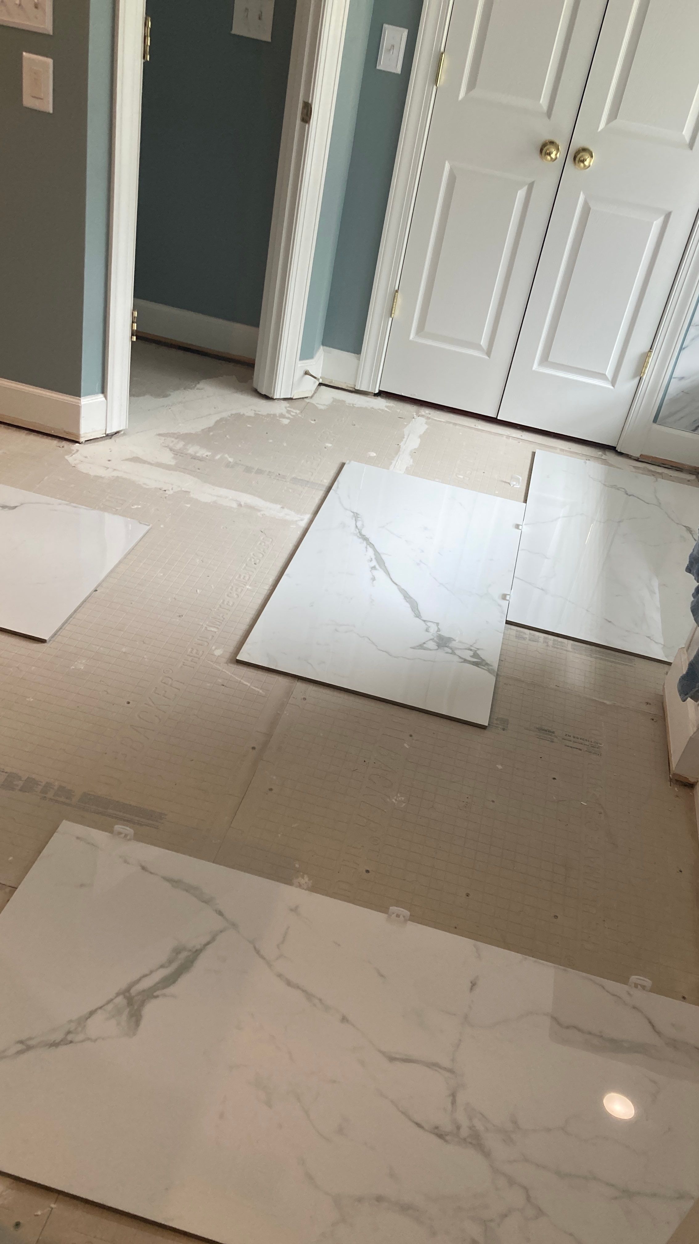 Lovely marbled bathroom floor  by Footprints Floors of Nashville