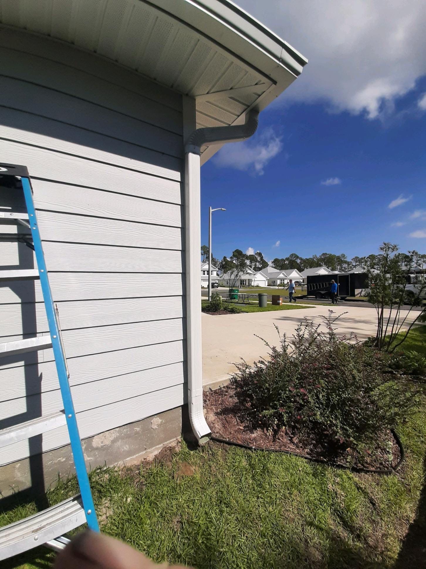 Seamless Gutter Installation using White by Gutter Professors