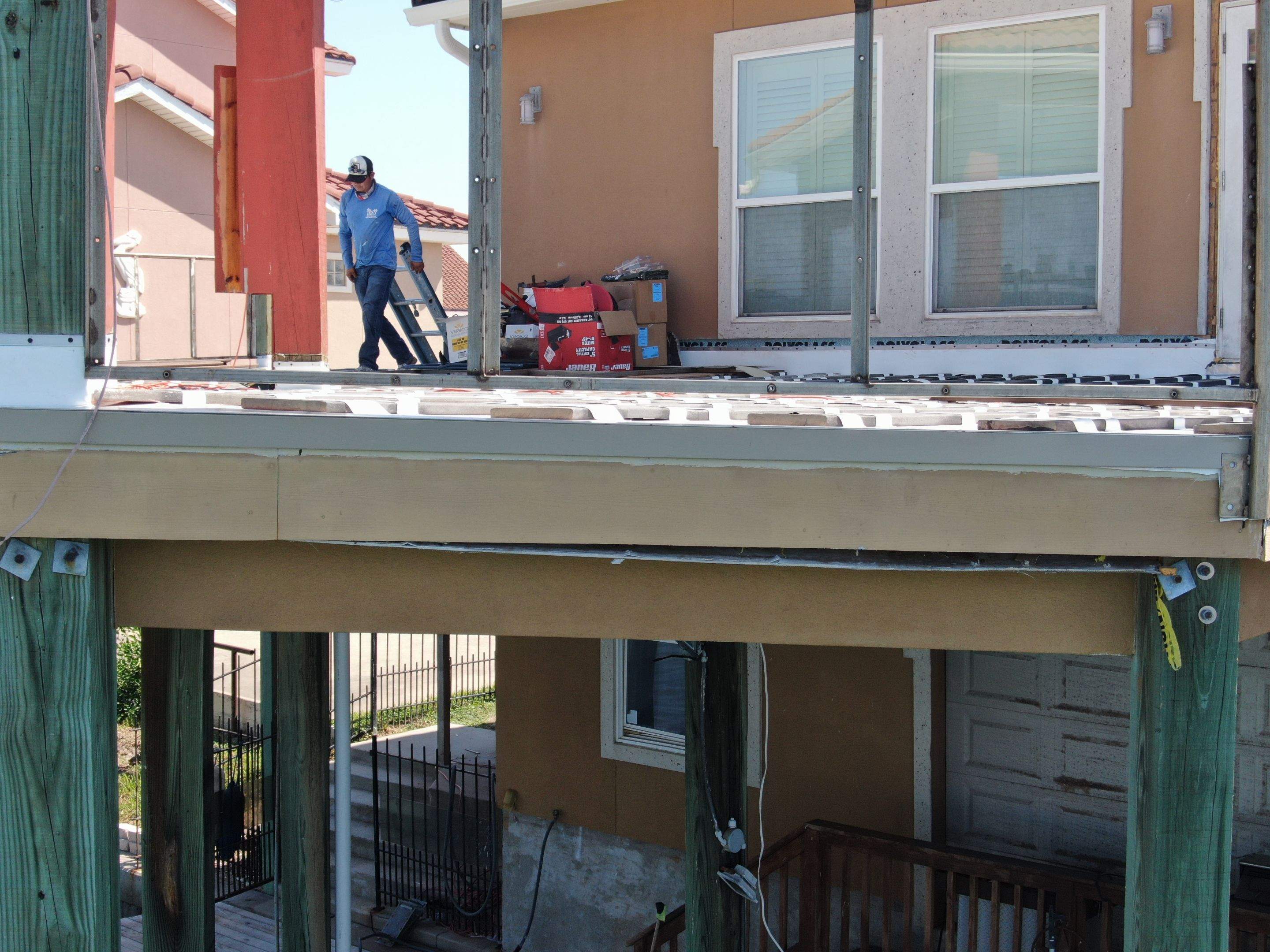 Walk Out Patio Cover by Bayfront Roofing and Construction