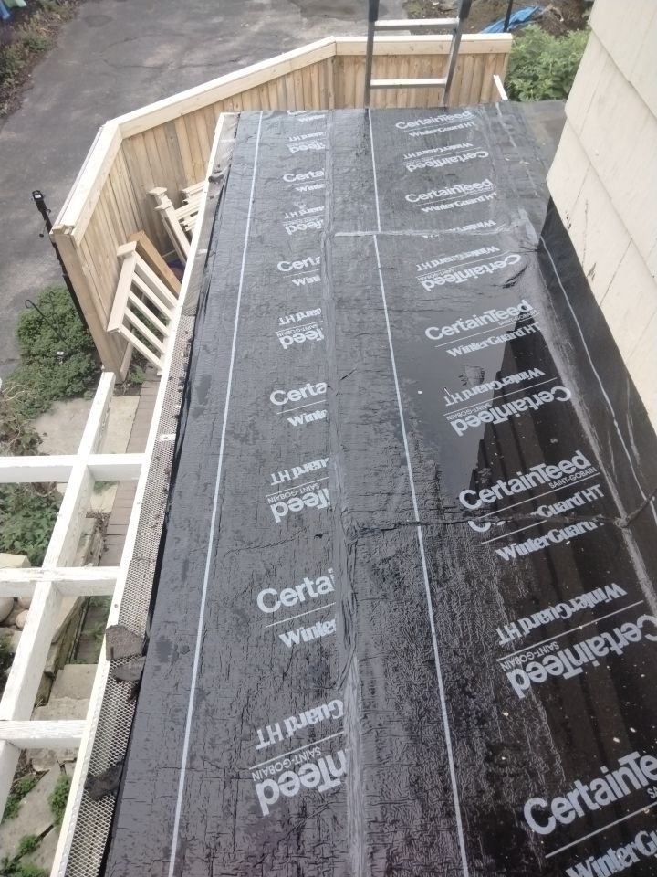 Residential Roofing Installation, Dec-tek walk-out porch roof, siding on garage by Absolute Roofing and Construction