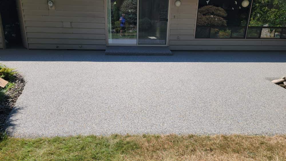 Monticello Sanctuary: A Patio of Refined Tranquility by Concrete Coating Experts Inc.