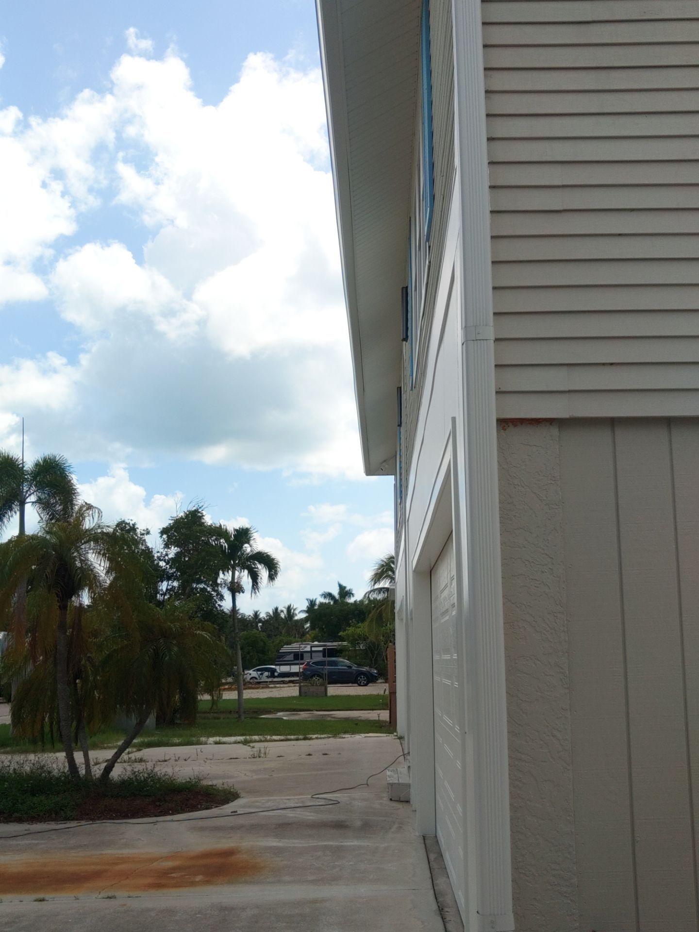 Complete Gutter System with Downspouts & Guards in Fort Myers Beach FL by Gutter Professors