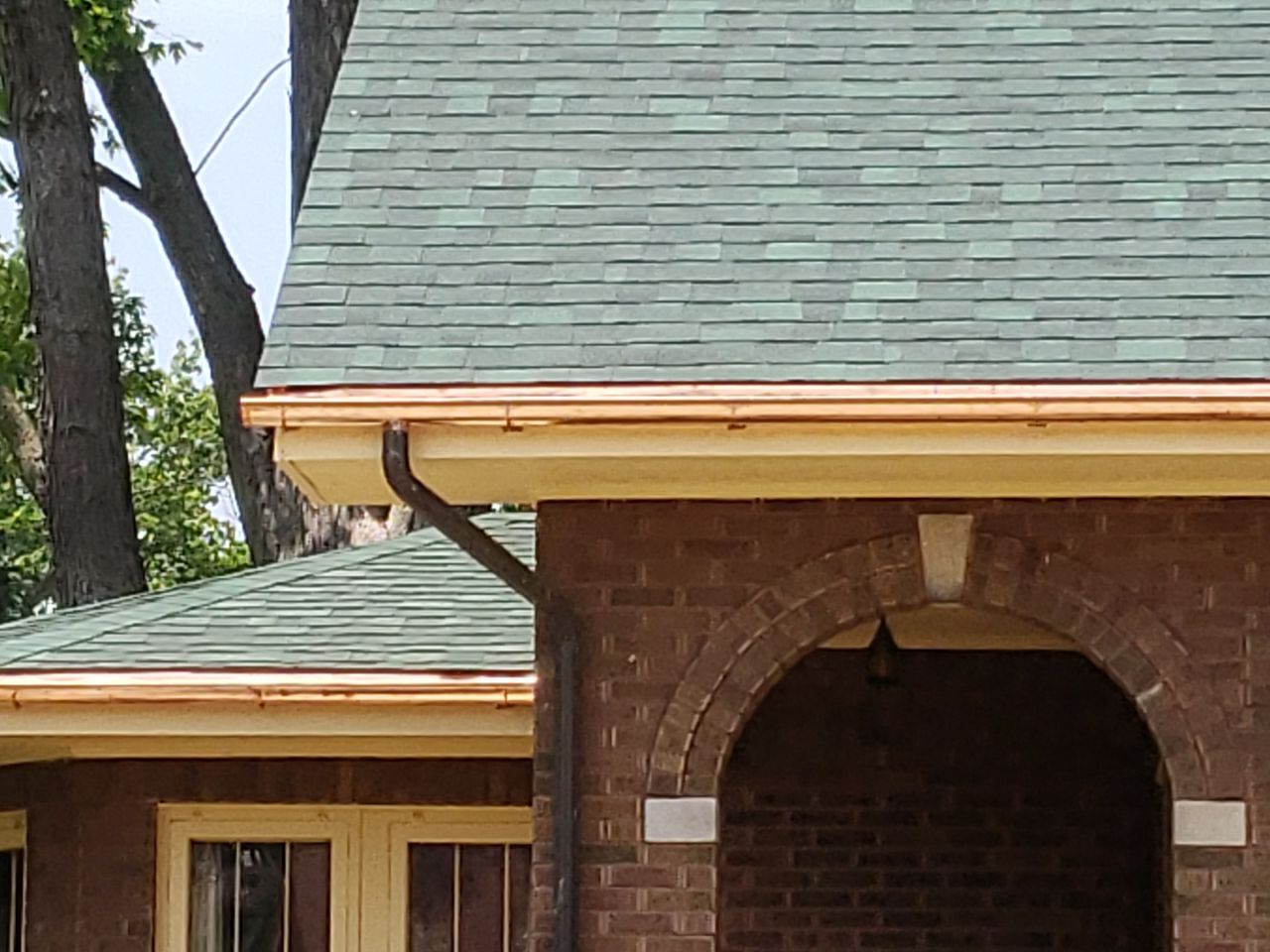 Asphalt Shingle Replacement and Half Round Copper Gutters Installation by Custom Installations, Inc.