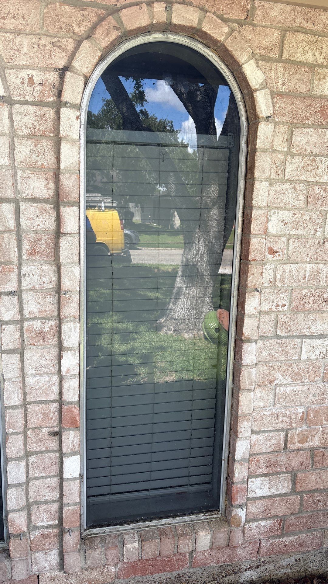 Colored Vinyl Windows to blend into brick by Bayfront Roofing and Construction