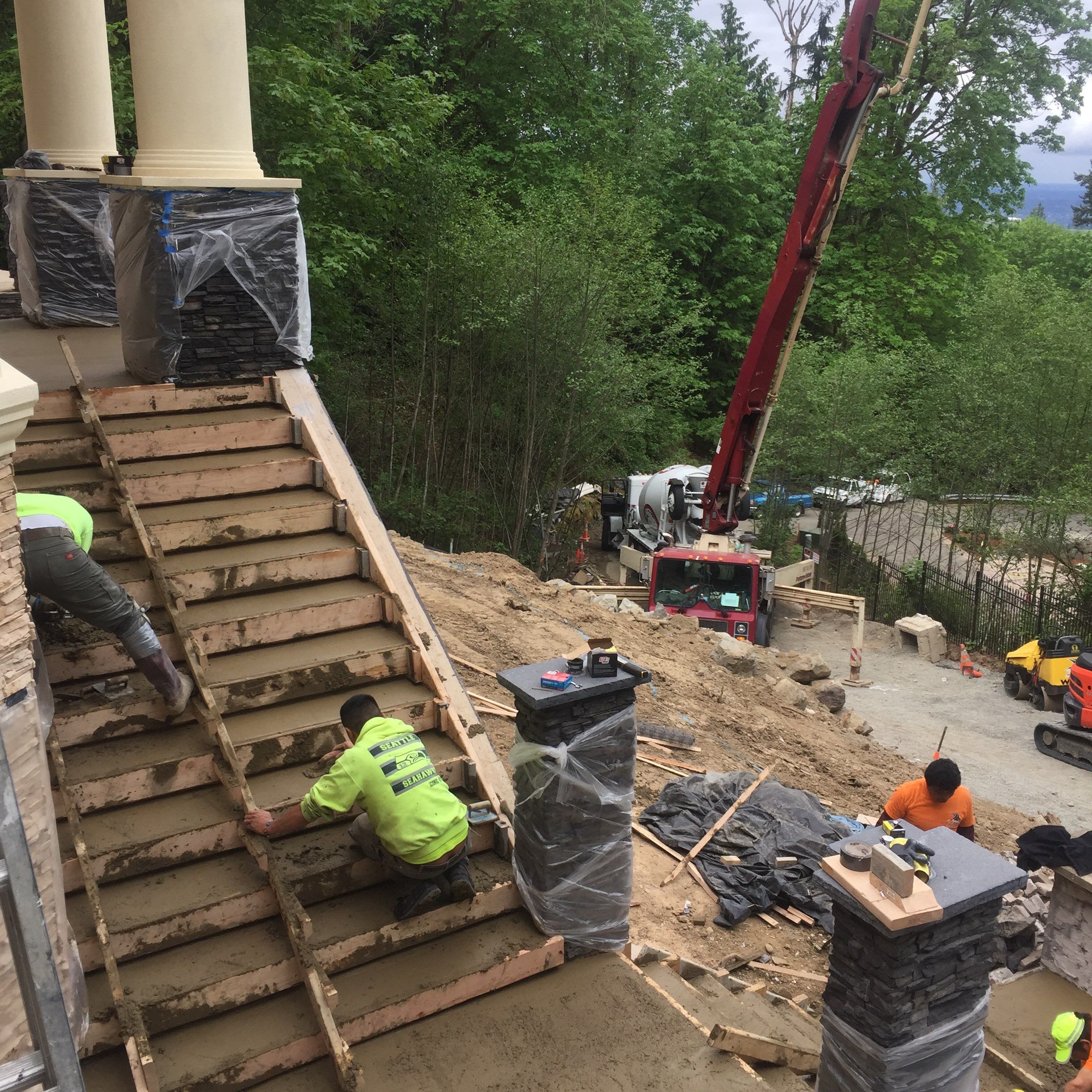 Asphalt Driveway and Stamped Concrete Patio Finish  by Jireh Asphalt & Concrete Inc 