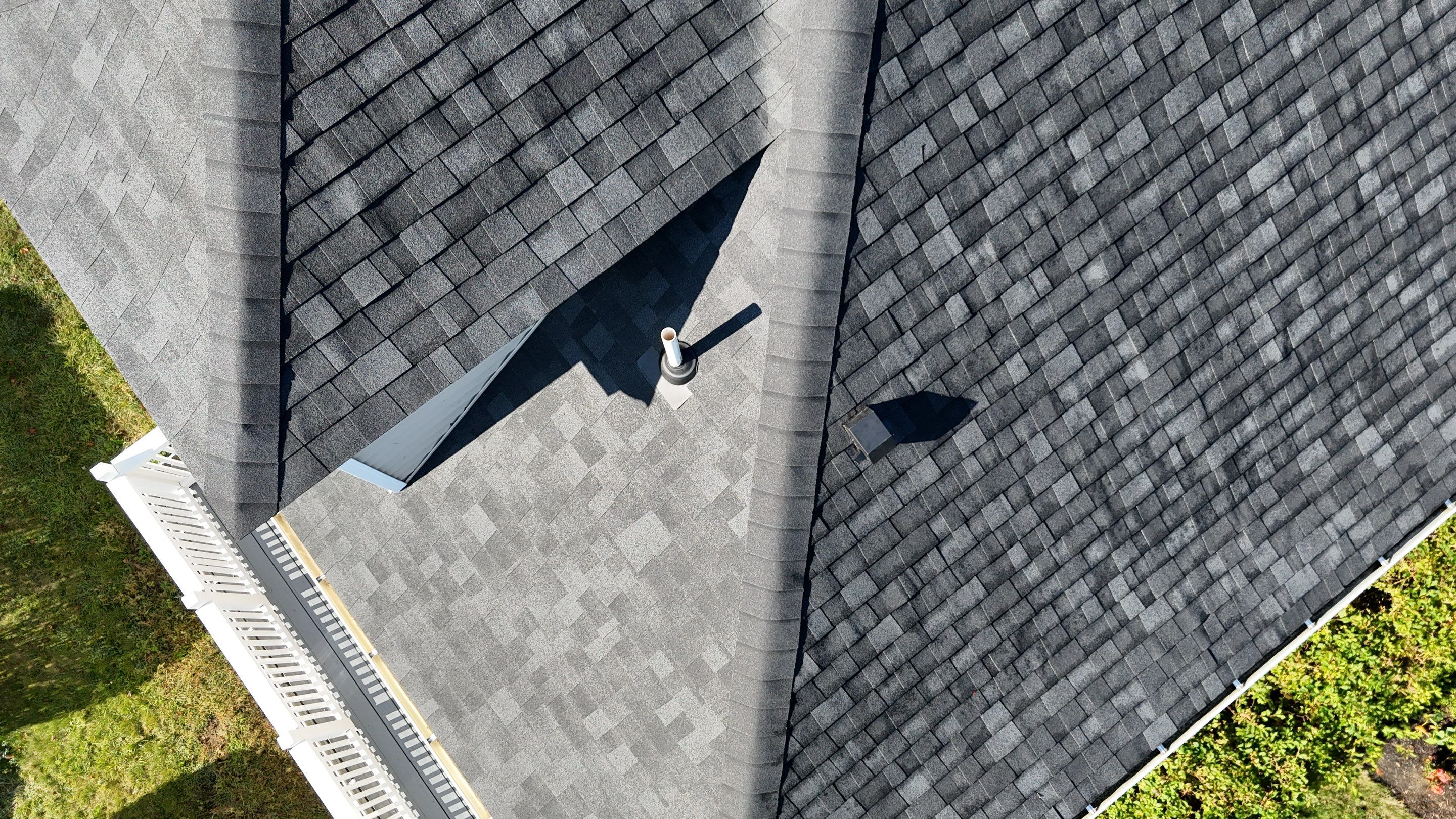 Roof Replacement with Skylight Flashing in Waltham, MA by Mighty Dog Roofing of Greater Middlesex County