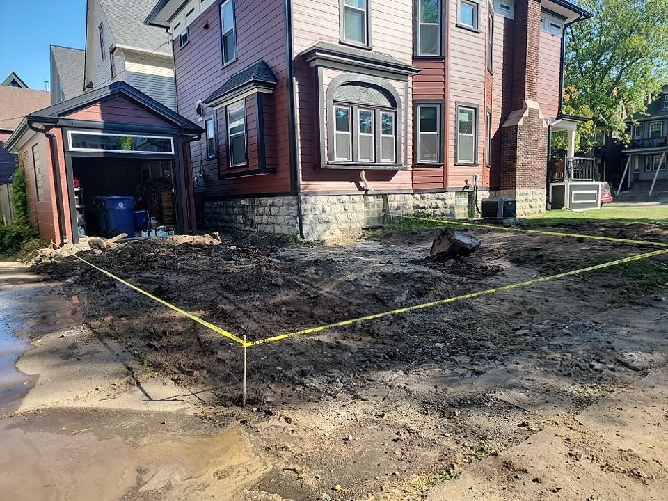 Exterior Renovations- Siding, Stamped Concrete, Porch, and Railings by Ivy Lea Construction