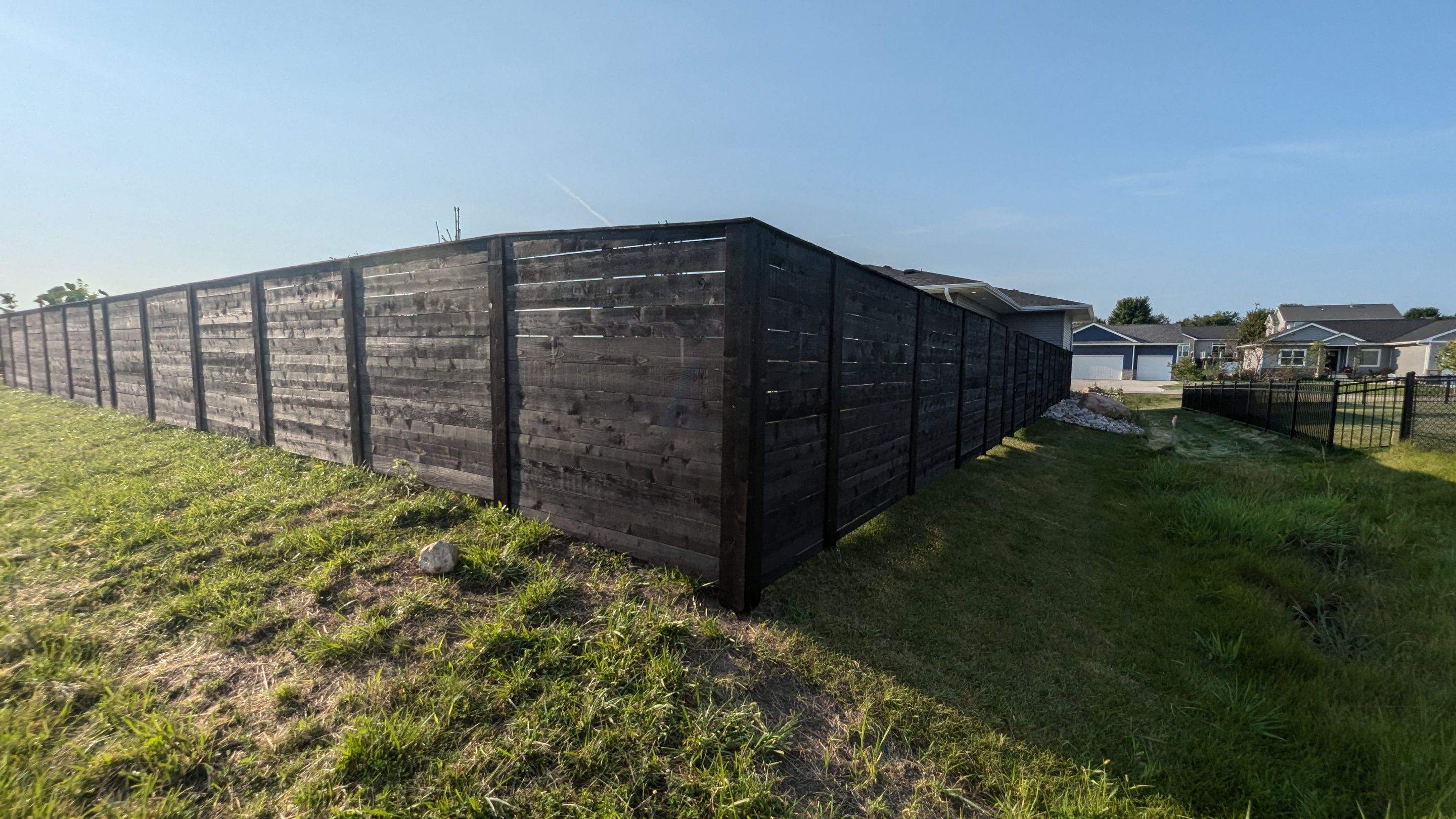 Modern Black Stained Horizontal Privacy Fence Installation in Cedar by Perfect Picket Fence and Stain