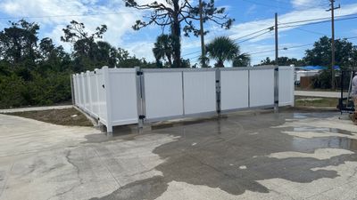 Commercial Chainlink and Vinyl Fence With Aluminum Framed Gates On Dumpster Enclosure