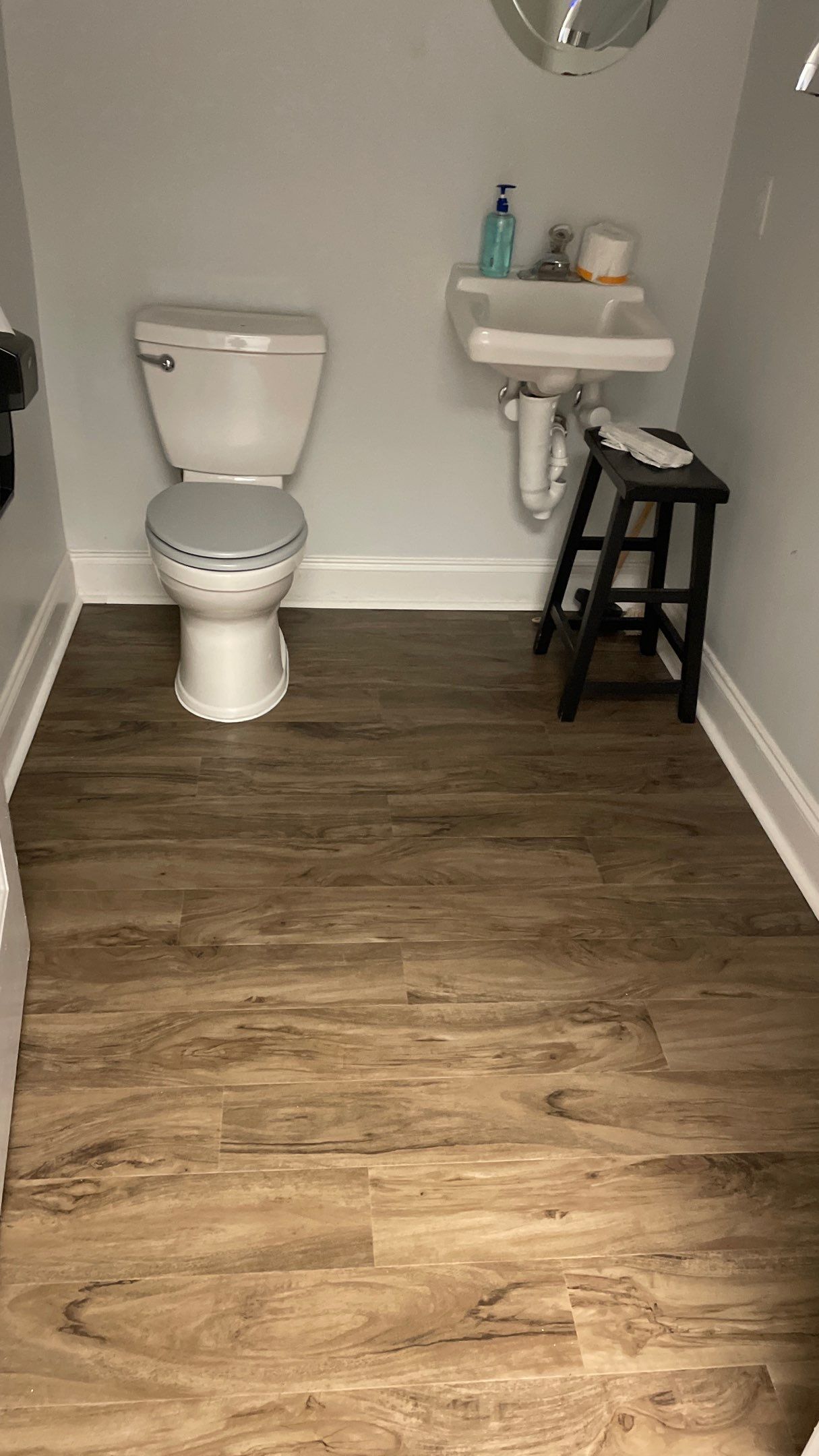 Office Remodel from Worn Out Carpet to Sleek Glued Down LVP by Footprints Floors of Coastal Carolina