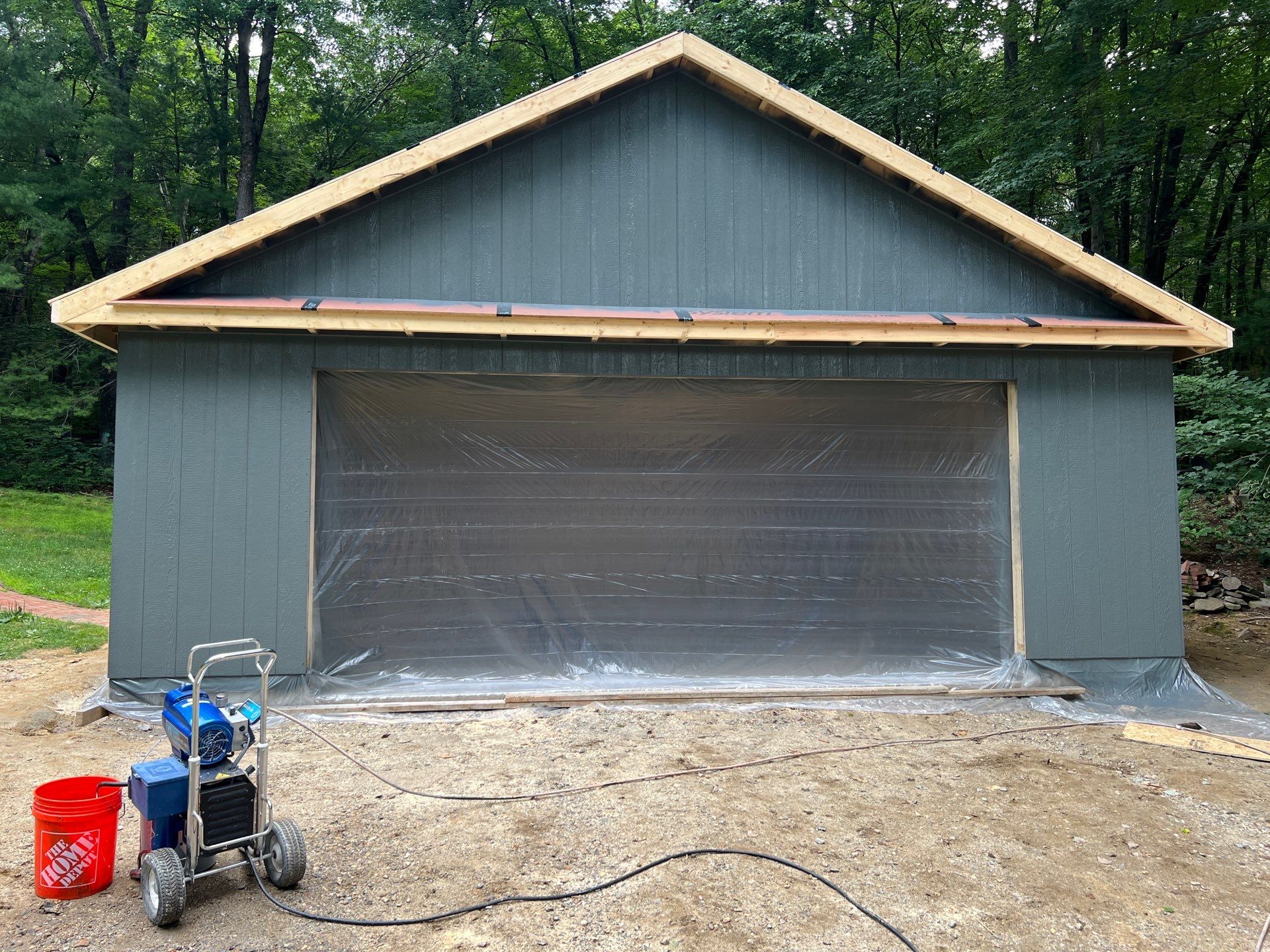 Garage using LP SmartSide Panel Siding by Chagnon Building & Remodeling LLC