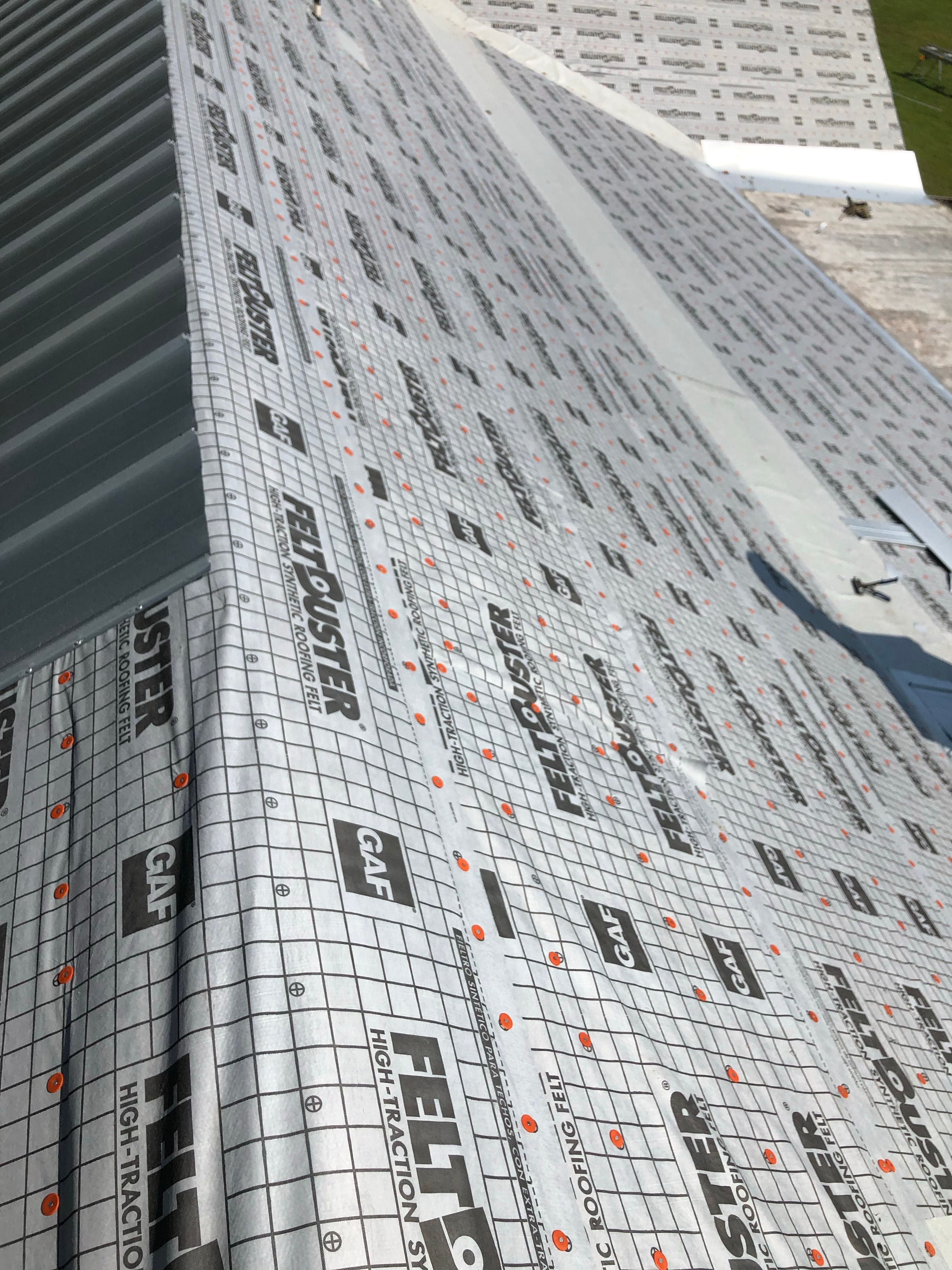 Residential Roofing Installation using Metal roofing by American Roofing & Construction LLC