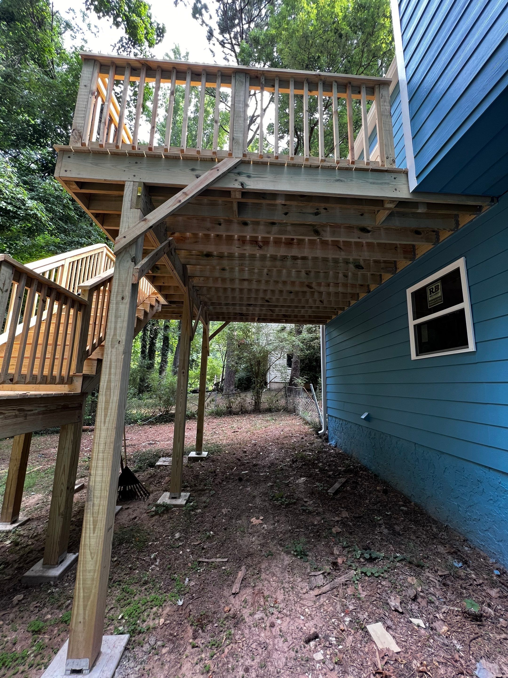 Elevated Wood Deck and Blue Lap Siding Installation in Kennesaw by Swift Home Renovations