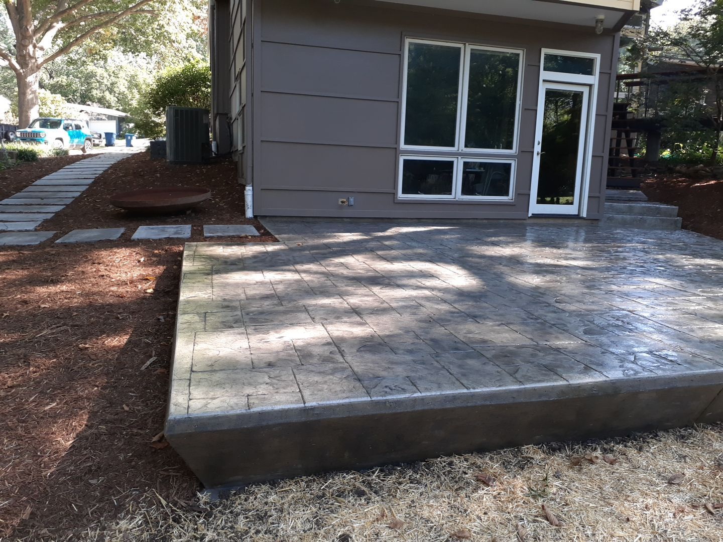Back Yard Cantilivered Patio by LAND ESCAPES LLC