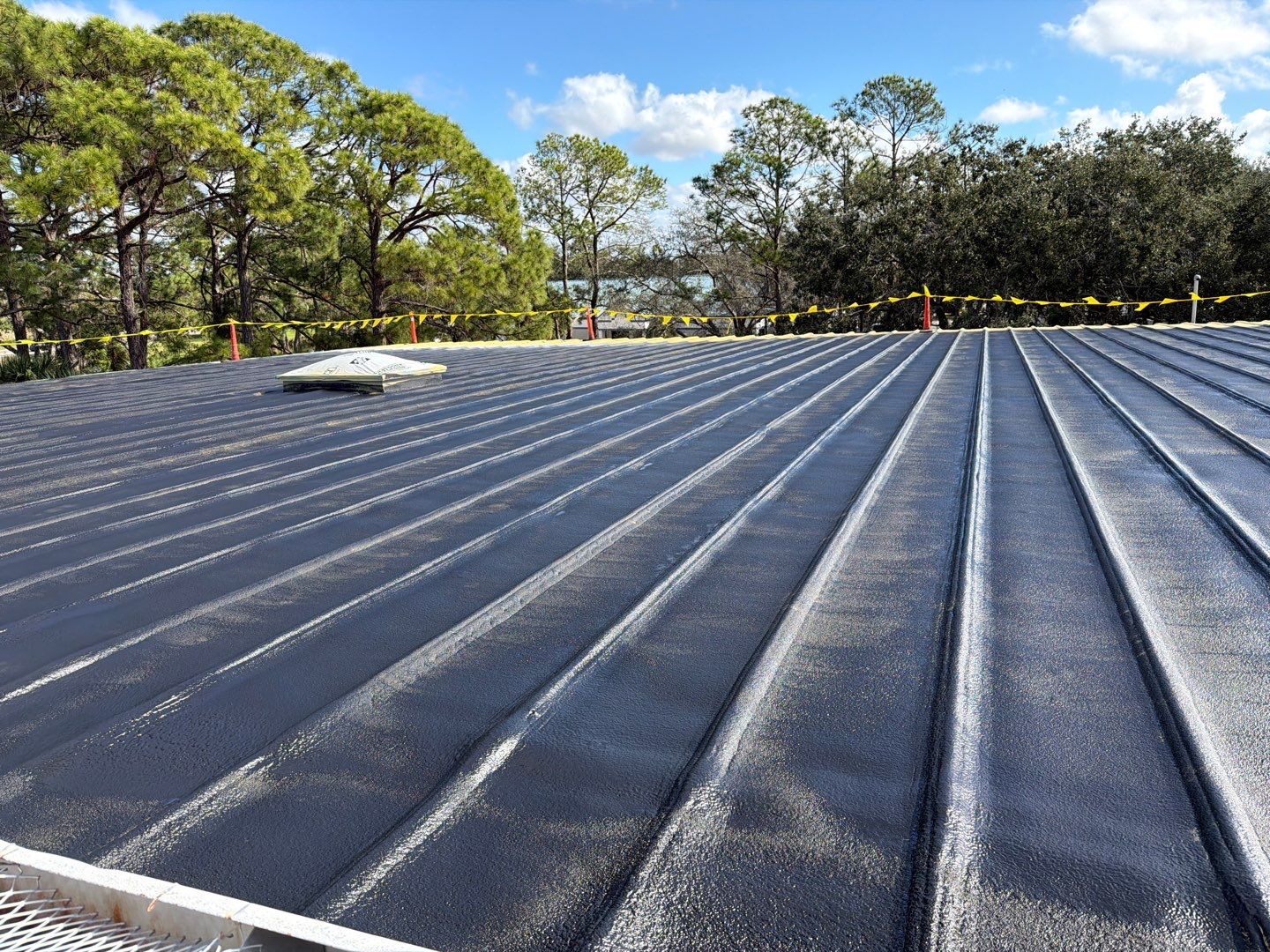 Sarasota Industrial Warehouse Metal Roof Silicone Coating Restoration by CES Roofing