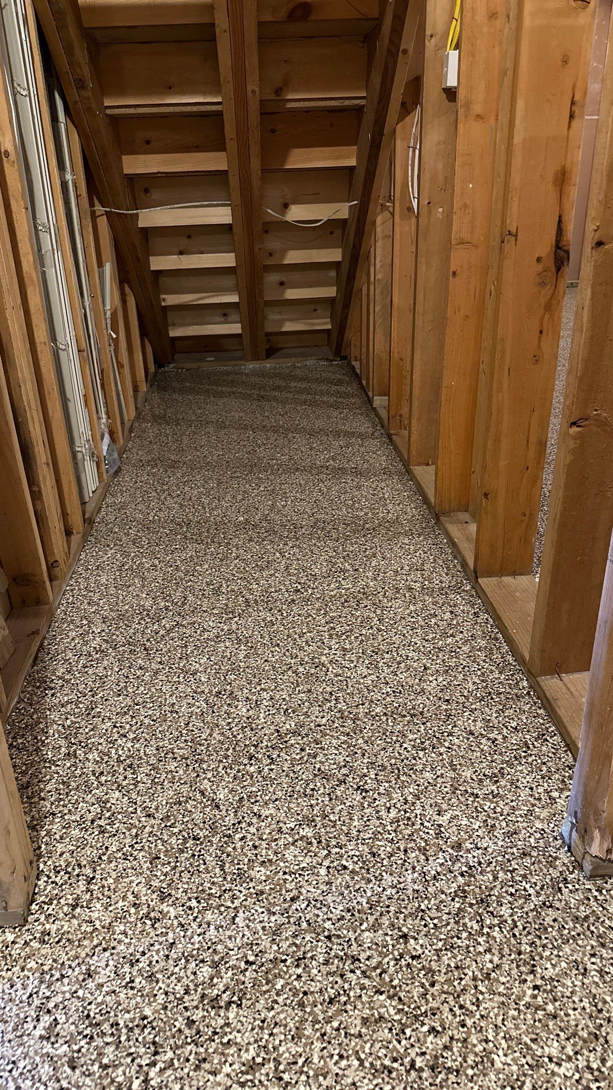 Shelly E. chose a riverbed flake floor for their basement  by Banner Garage