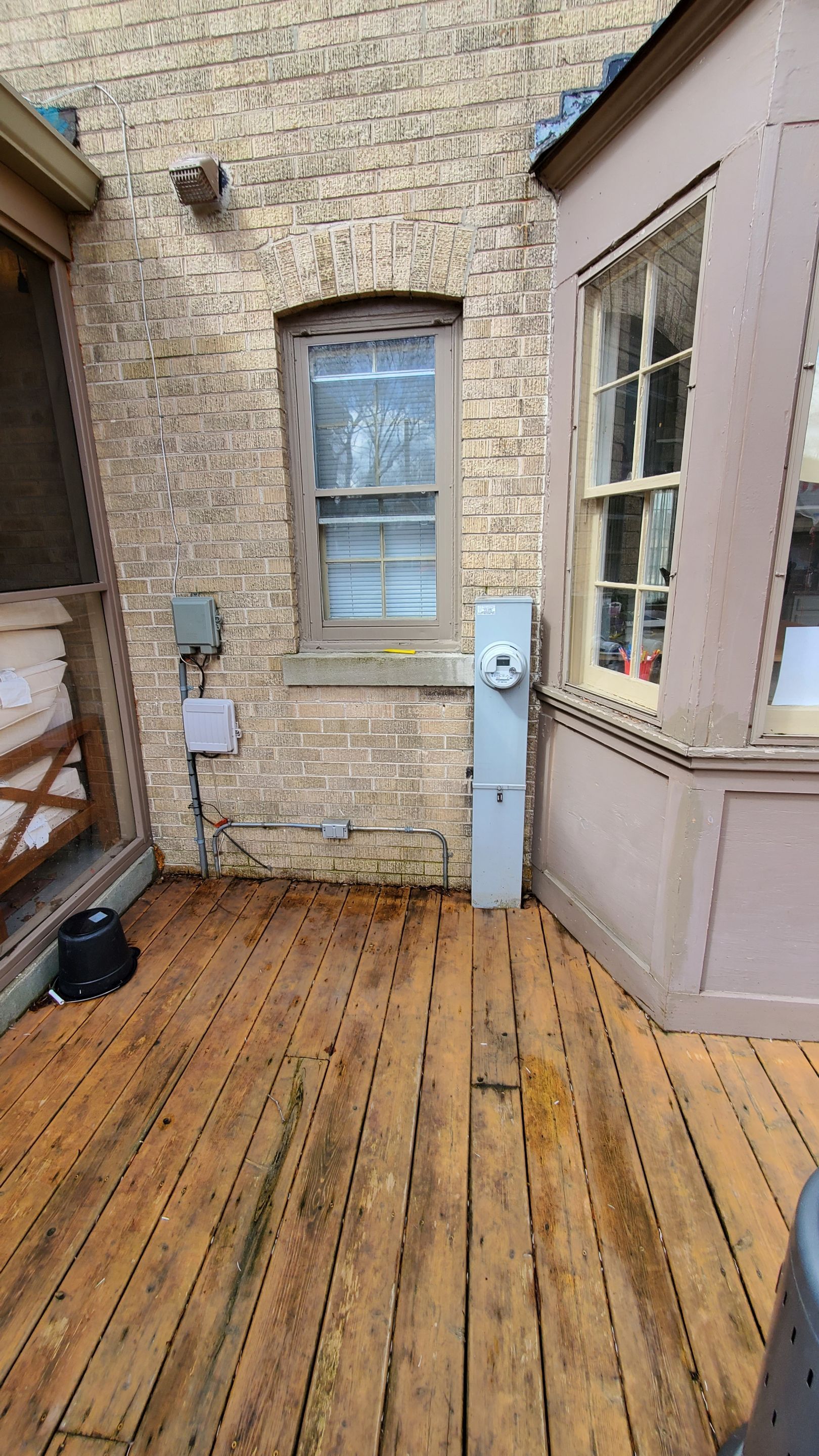 Wood cleaning and staining using Armstrong cloark oil stain by Northern Power Washing LLC.