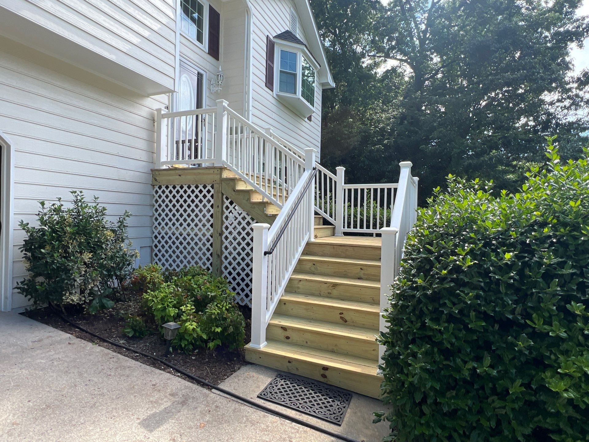 Front Entrance Deck Stair Replacement with White Vinyl Railings in Lawrenceville by Swift Home Renovations