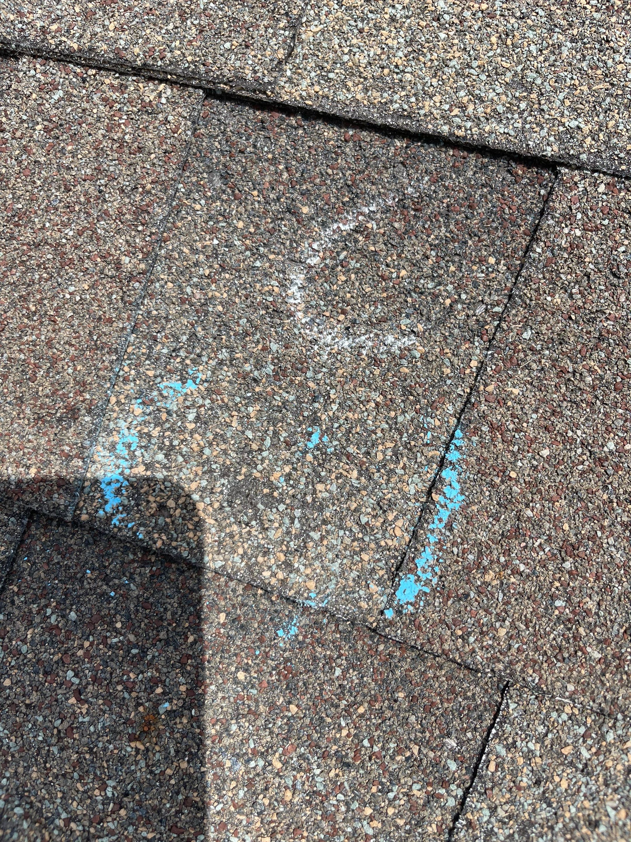 Hail Damage on a Roofing System by Icon Roofing And Construction 