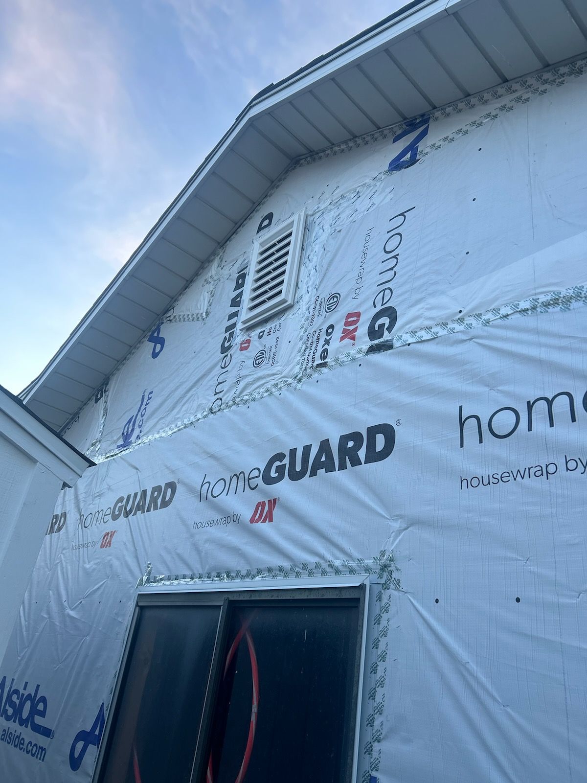 Aluminum Siding Replacement with Blue Dutch Lap Vinyl Siding and White Trim by ASAP Roofing & Exteriors