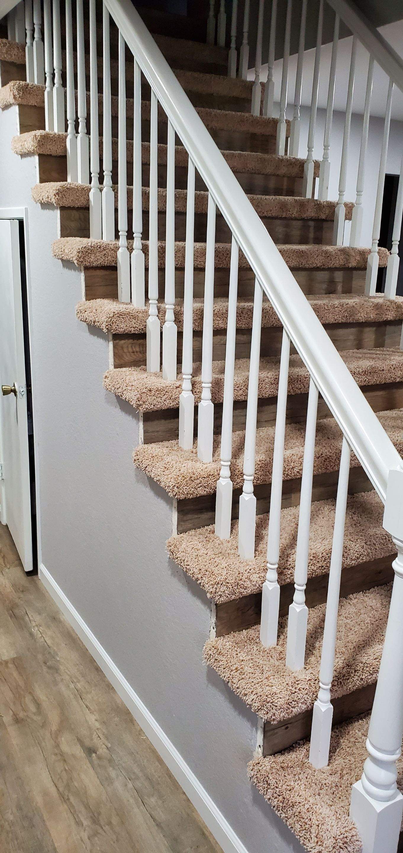 Carpet Install on Stairs with Spindles by Ardent Carpet Restore LLC