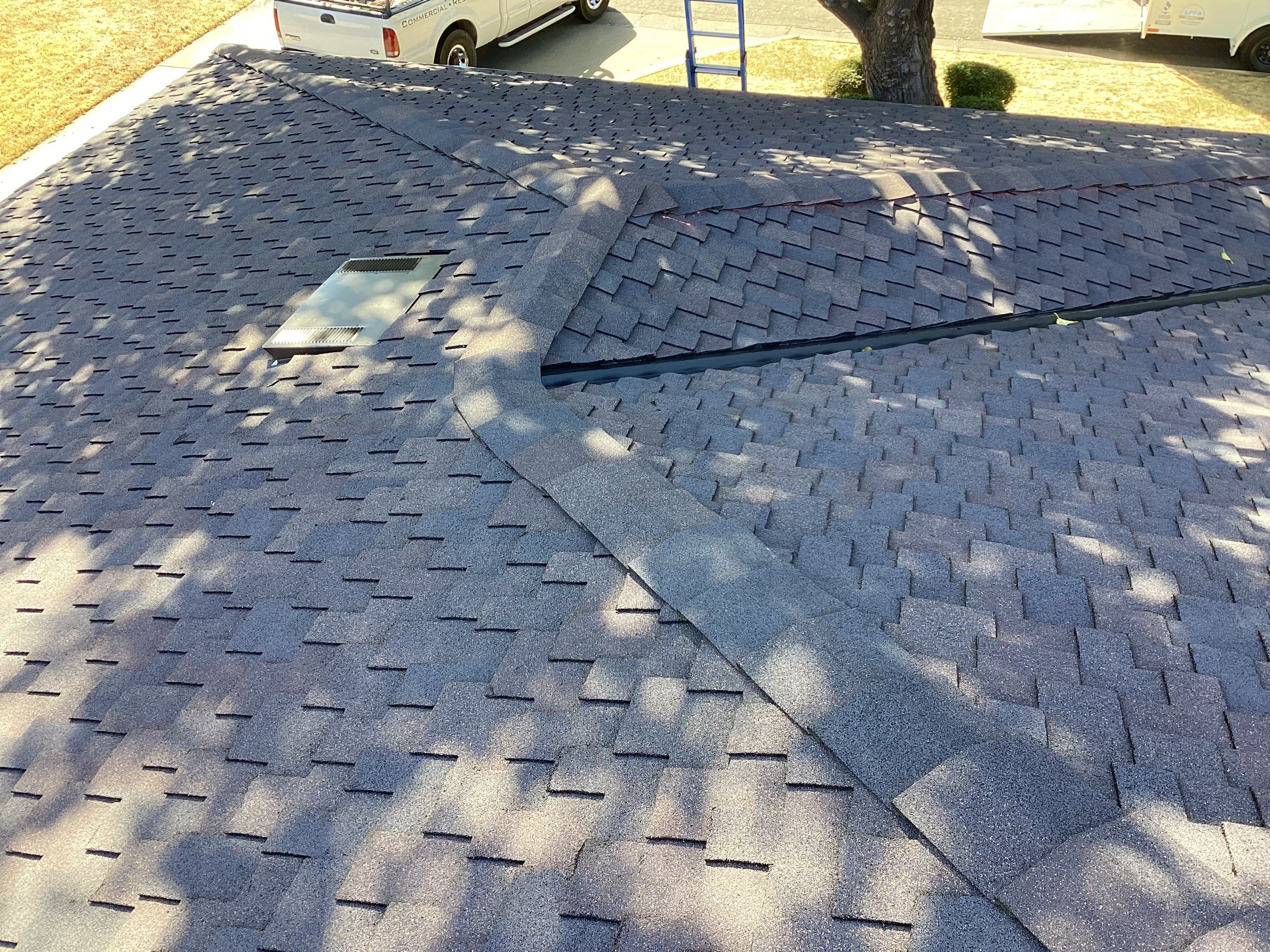 Installation of Certainteed Presidential shingles on residential house by Straight Edge Roofing Inc