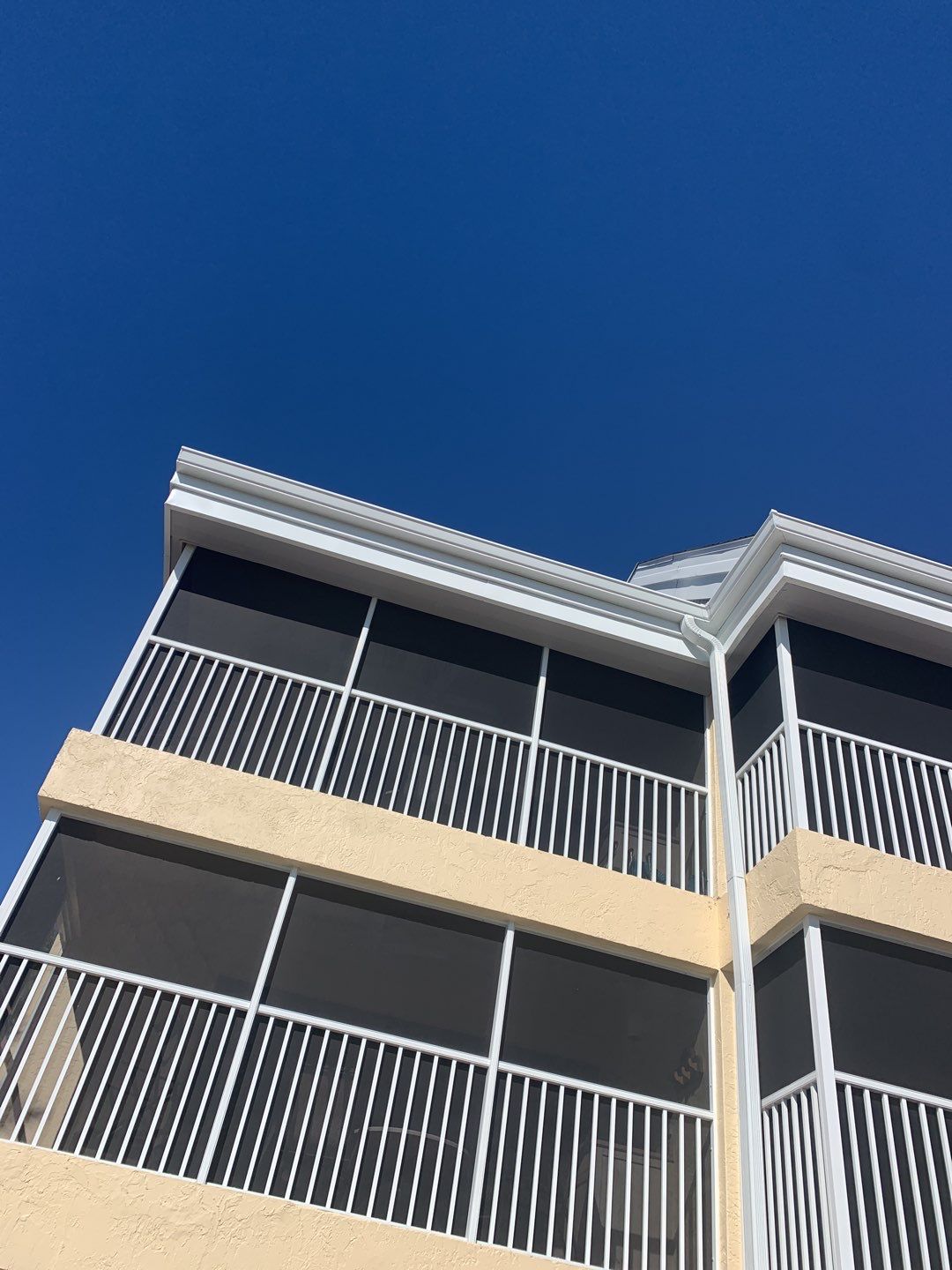 White Seamless Gutters and Downspouts in Sanibel FL by Gutter Professors