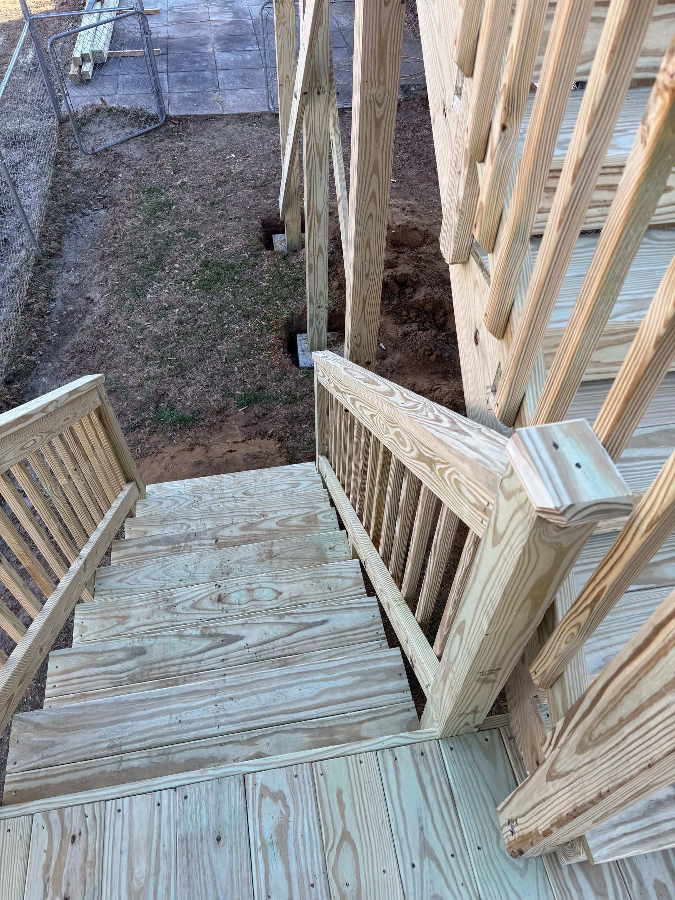 Elevated Pressure-Treated Wood Deck and Sliding Glass Door Installation in Clayton by The Remodeling Company