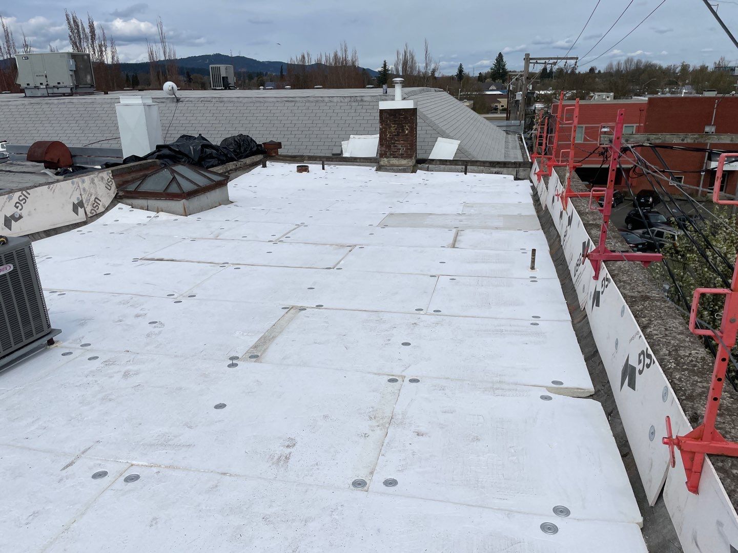 Commercial Flat Roof Installation using GAF 60Mil TPO  by Orezona Building & Roofing Company, Inc.