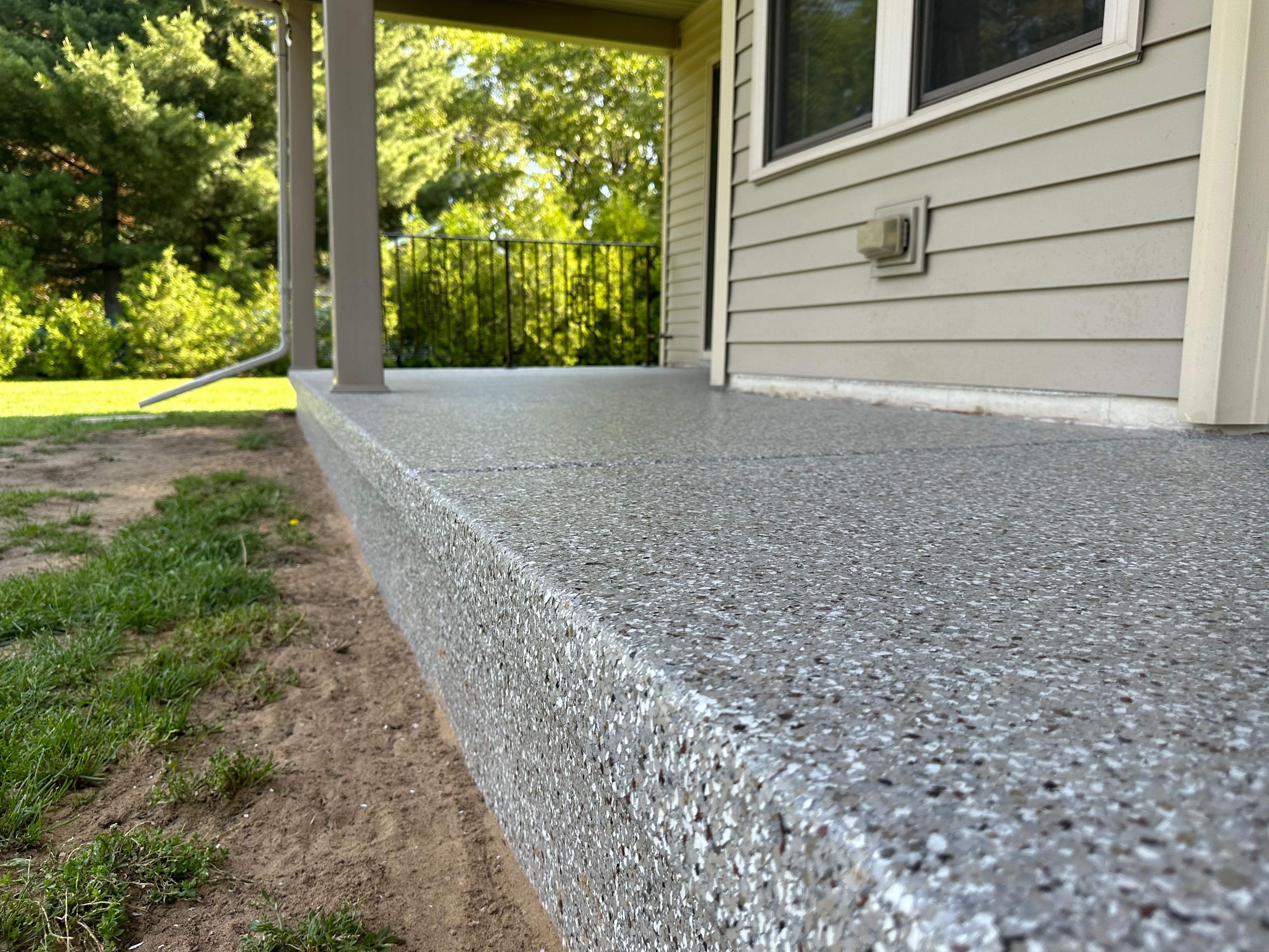 Creekbed Back Patio  by Level 10 Coatings