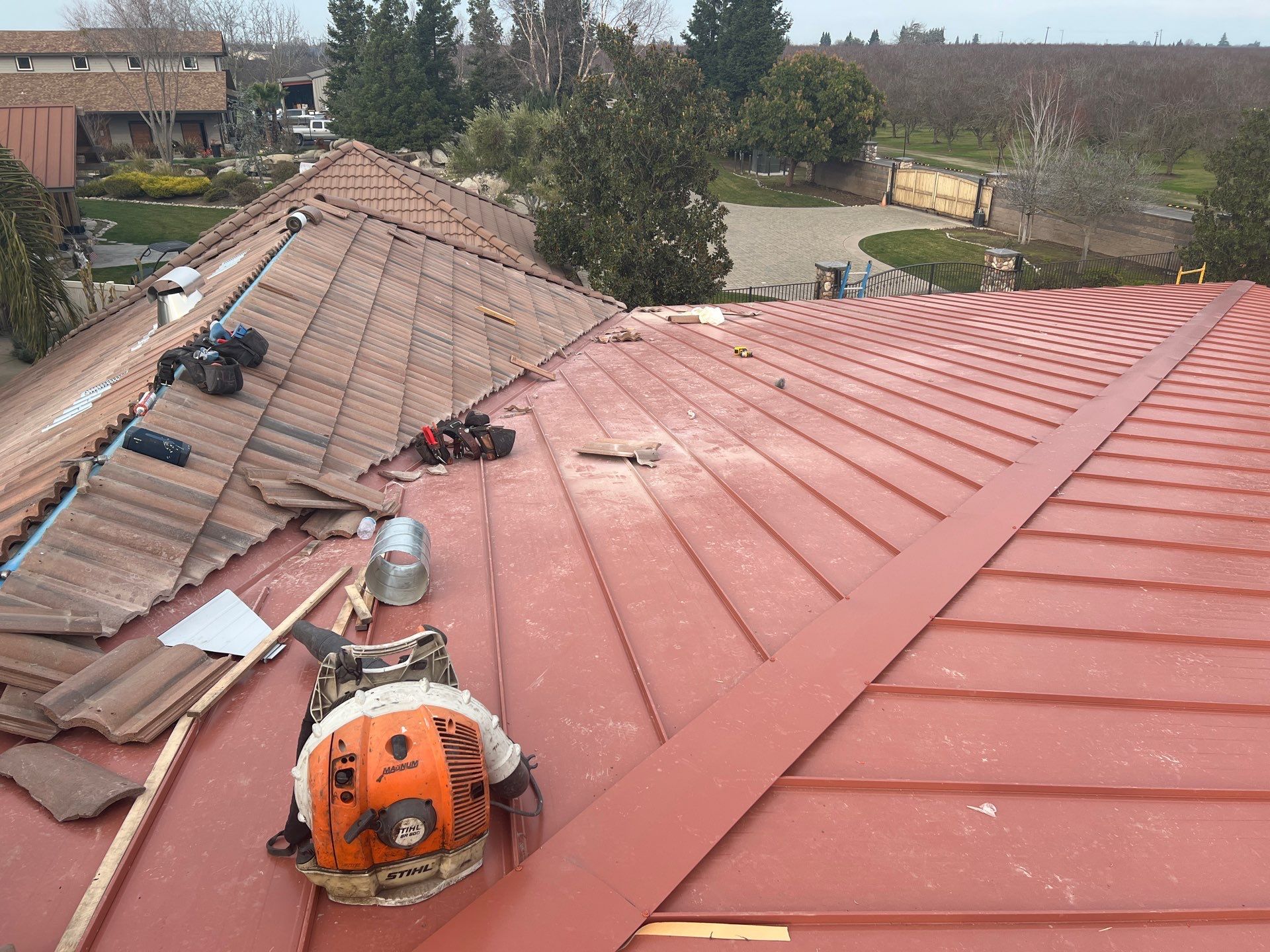 Tile, Metal, and TPO roofing project (new construction) by Straight Edge Roofing Inc