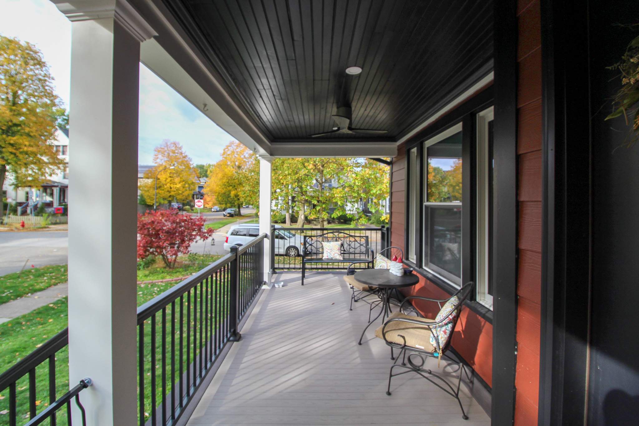 Exterior Renovations- Siding, Stamped Concrete, Porch, and Railings by Ivy Lea Construction