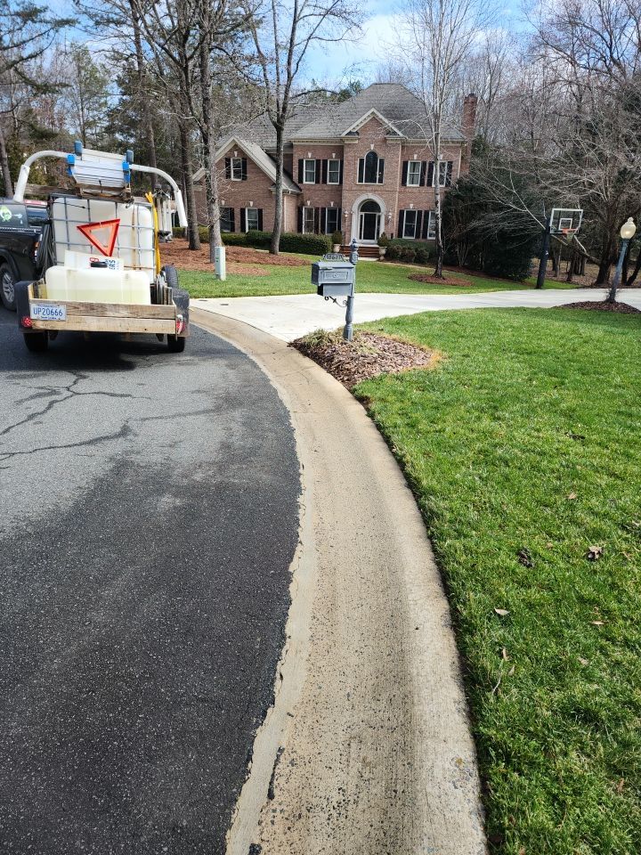 Driveway Clean using cleaner by Power Wash Masters LLC