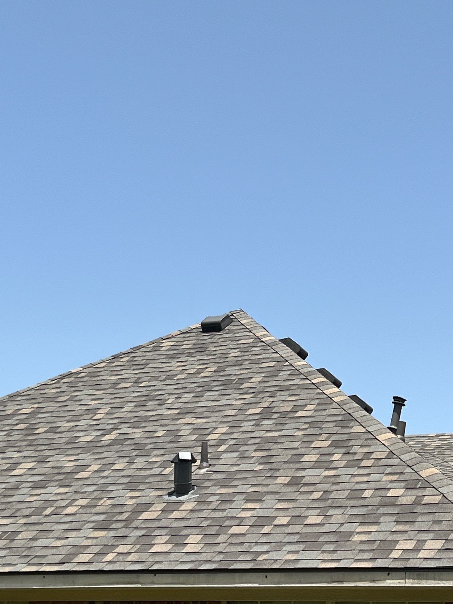 Red brick with IKO Cornerstone  by Tejas Roofworks + Restoration