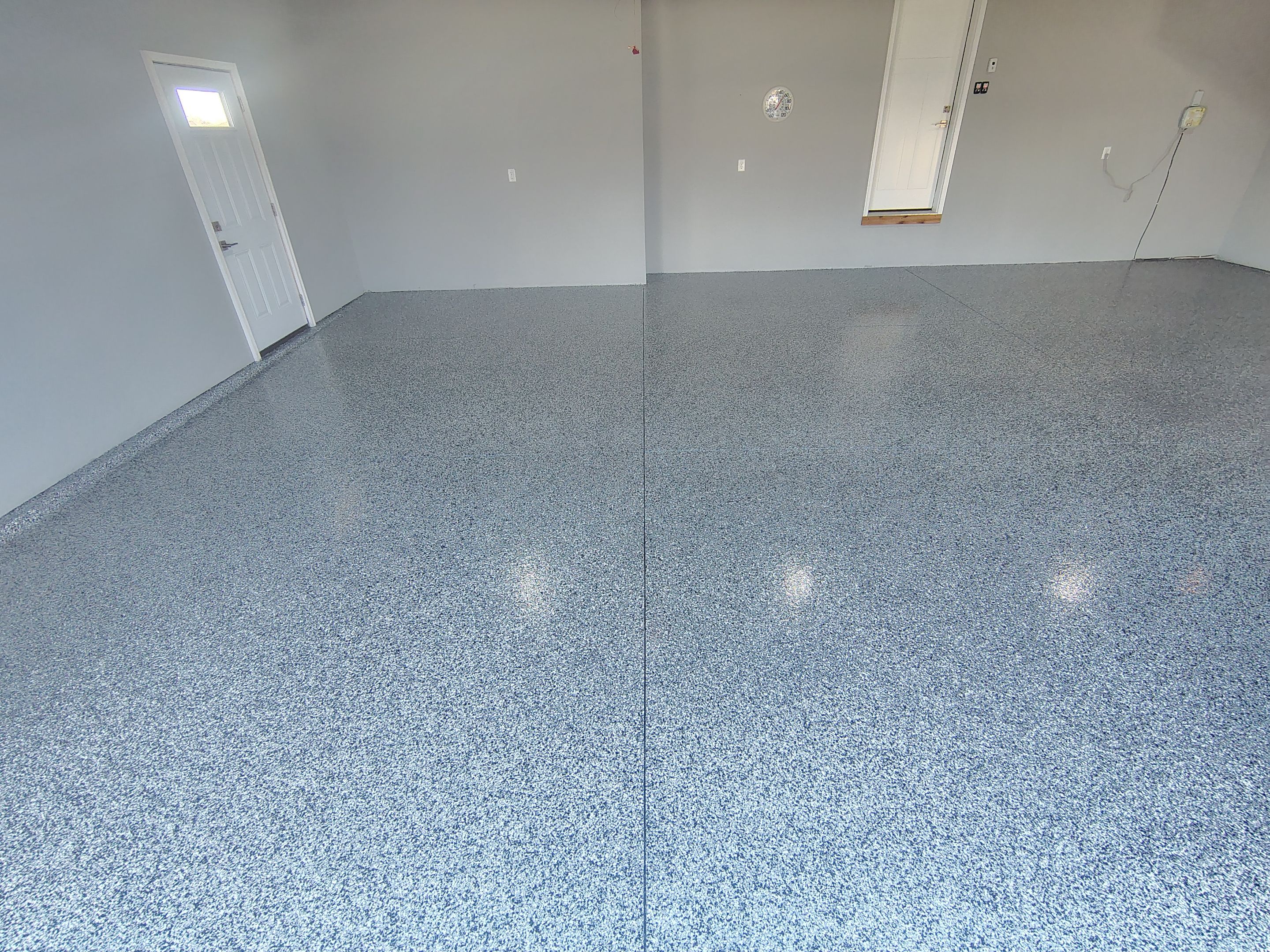Sioux Falls Garage Floor with Domino Flake by Select Painting, Coatings & Garage Cabinets