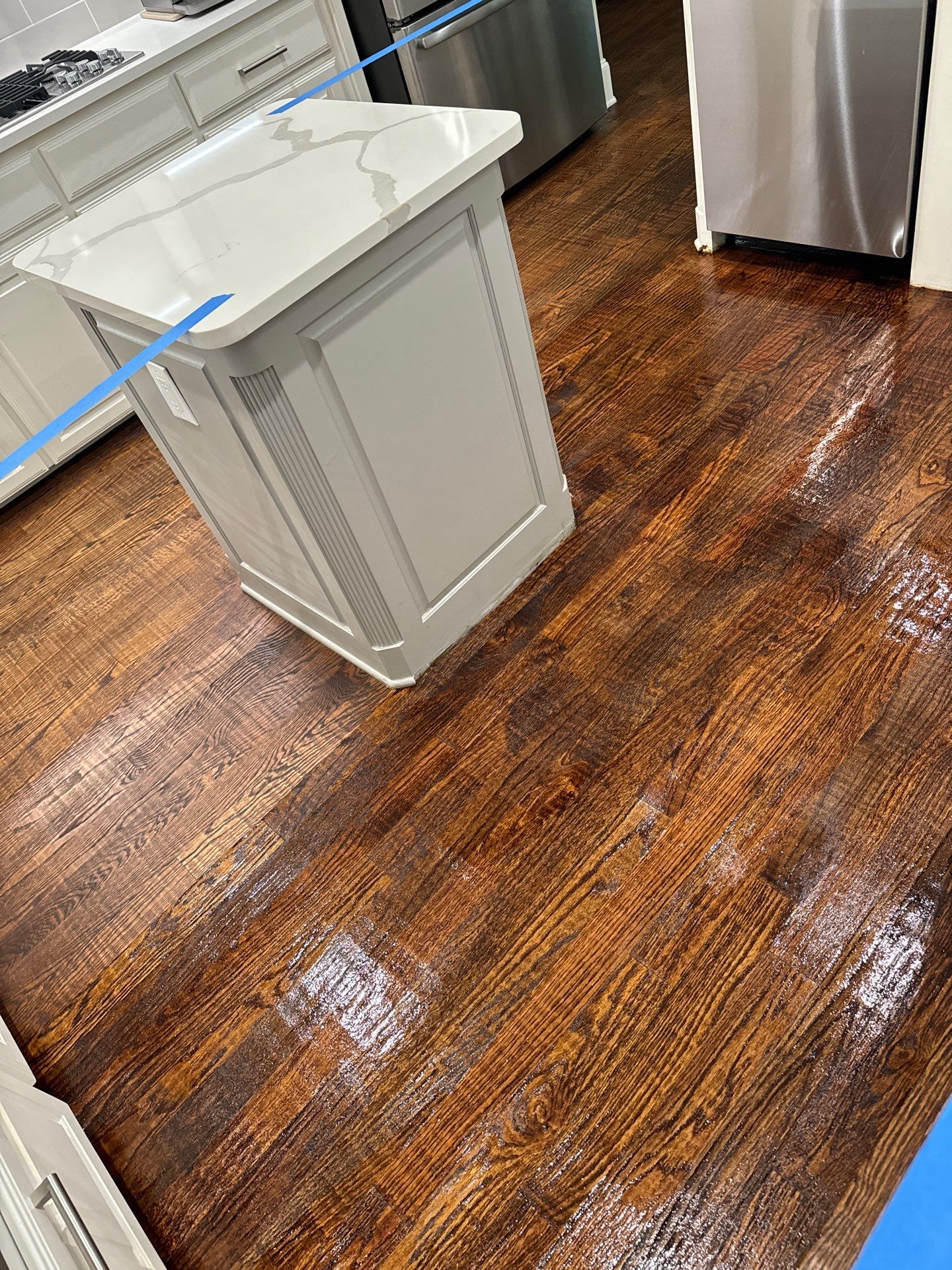 Dishwasher Flood Repair by Fine Line Flooring Inc.