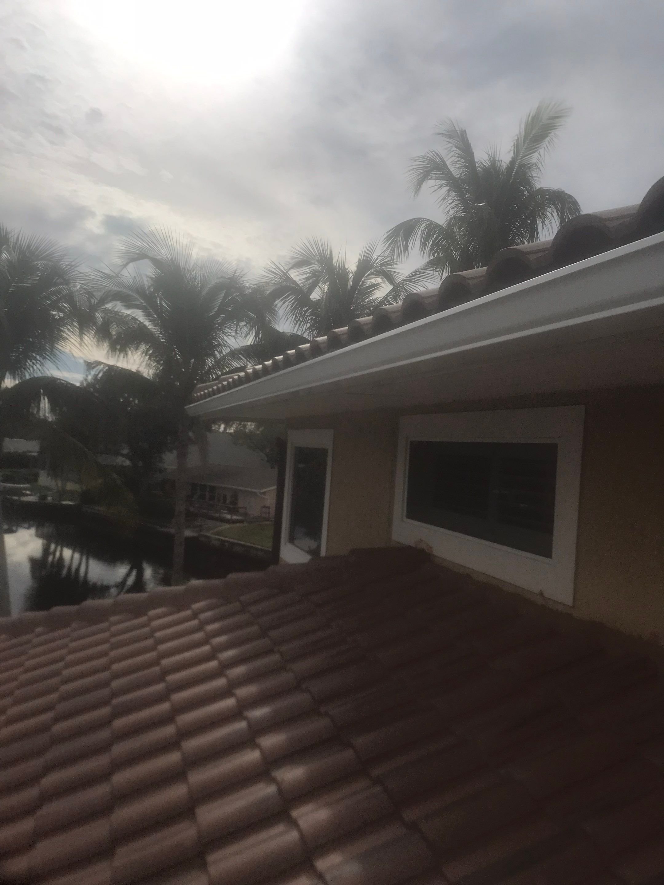 6 Inch Seamless Gutters using White Gutters and Downspouts in Fort Myers FL by Gutter Professors