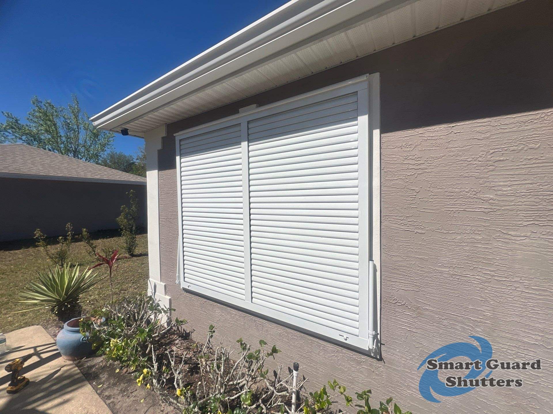Impact Bahama in Signal White by Smart Guard Shutters