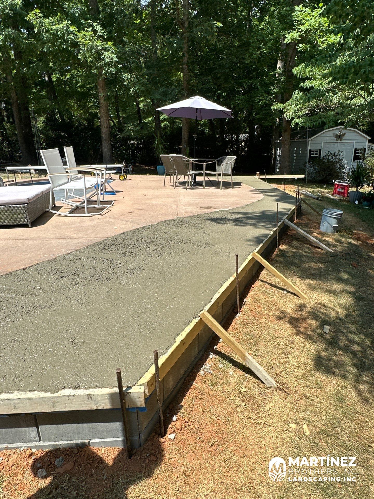 Cool decking pool in Youngsville by Martinez Brother’s Nc Landscaping Inc