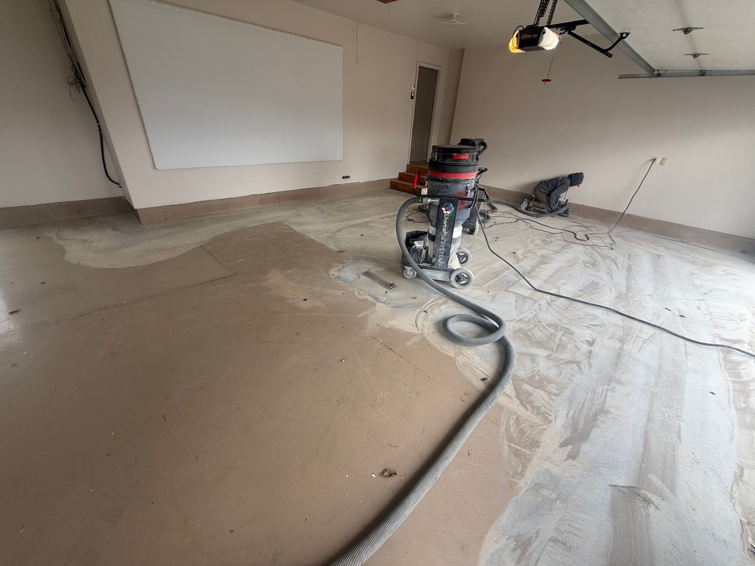 Residential Garage Floor Coating with Grey Speckled Epoxy Finish by Select Painting, Coatings & Garage Cabinets