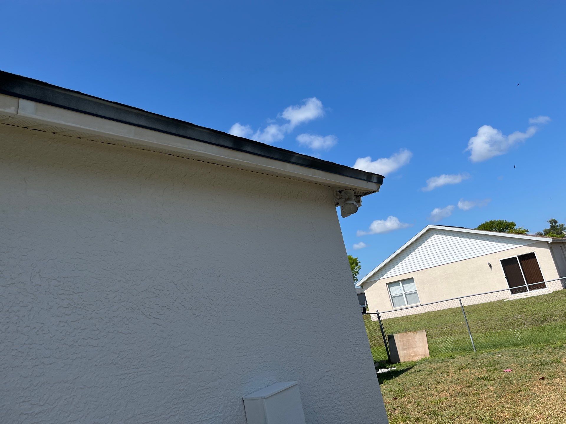 Black Seamless Gutters and Downspouts in Fort Myers FL by Gutter Professors