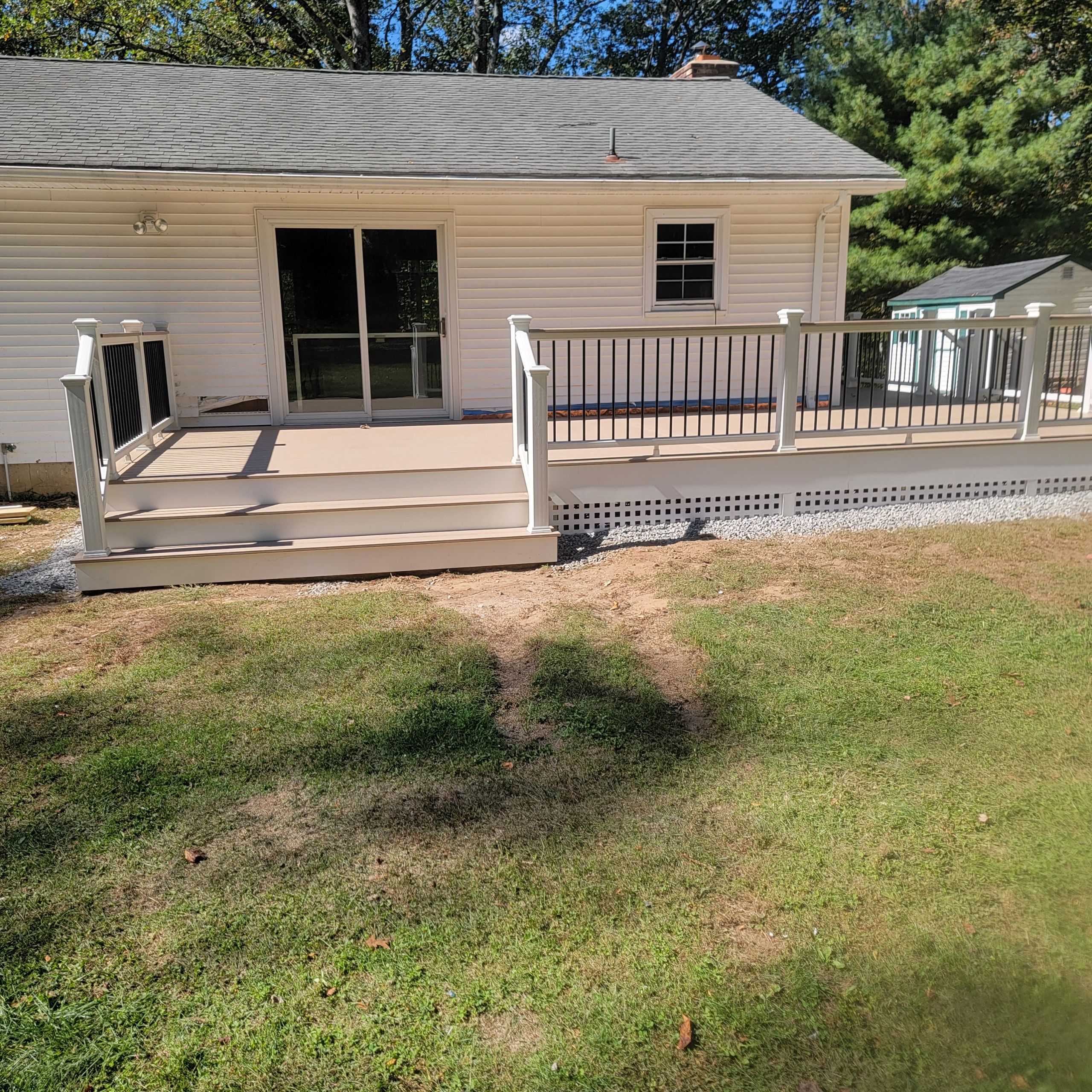 Deck replacement using Trex Transcend Rope swing and Transcend cocktail rail and trex lattice  by DiGiorgi Roofing and Siding Inc