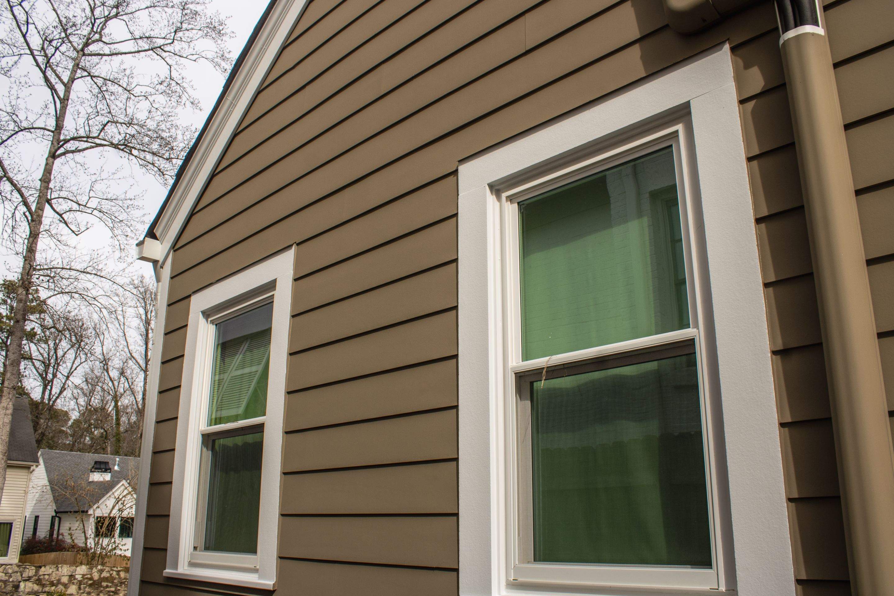 Full Siding Replacement, Deck Build, Exterior Paint, and Gutter Replacement by Nelson Exteriors