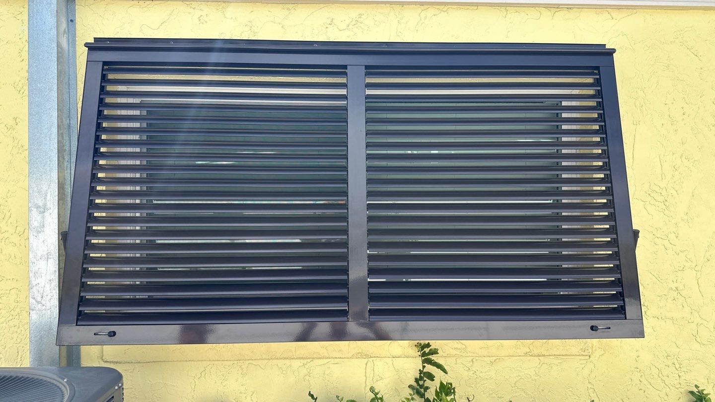 Hurricane Rated Bahama Shutters in Grey Brown by Smart Guard Shutters