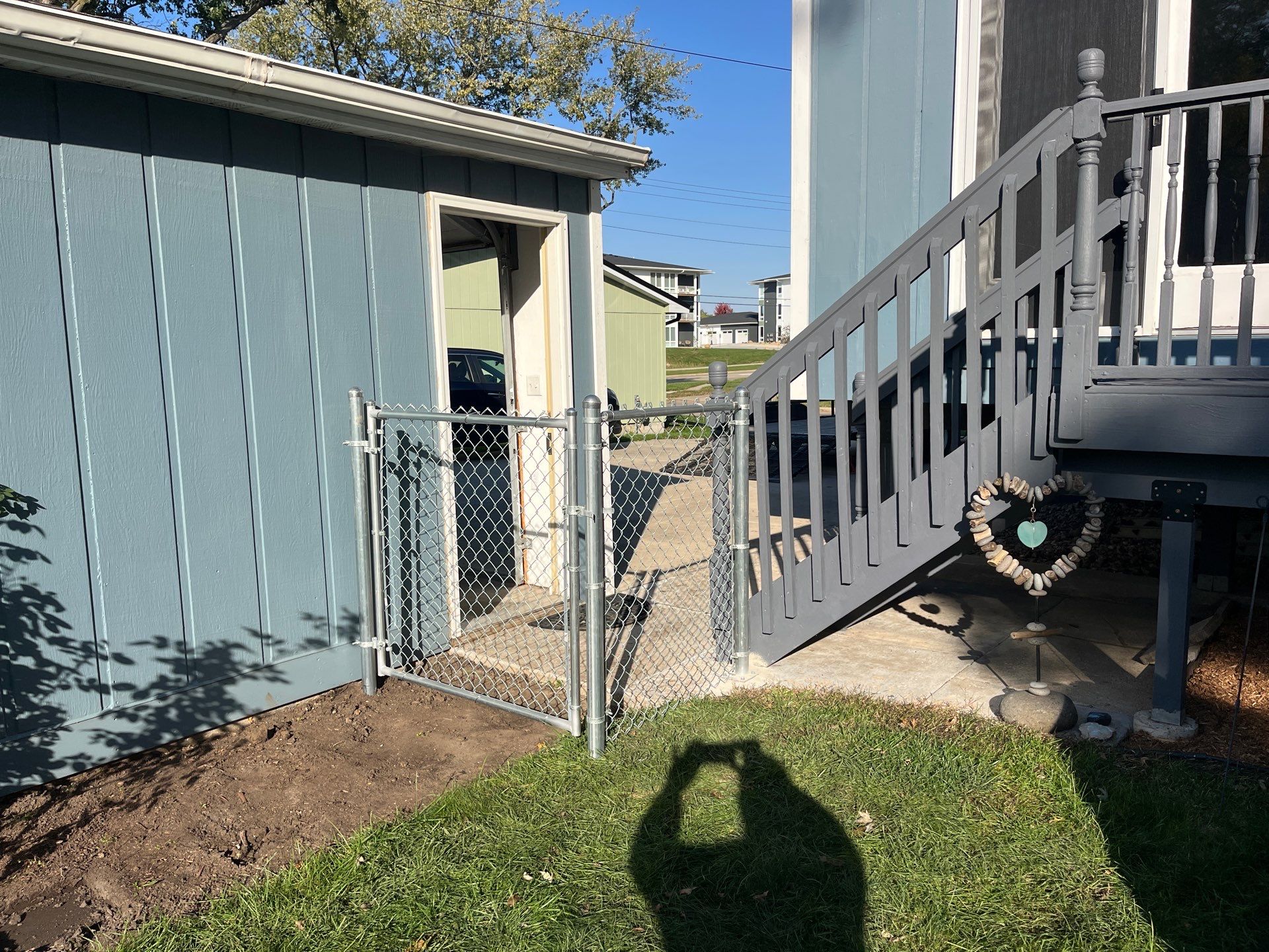 Chai Gray Vinyl Privacy Fence and Gate Installation in Cedar Falls by Perfect Picket Fence and Stain