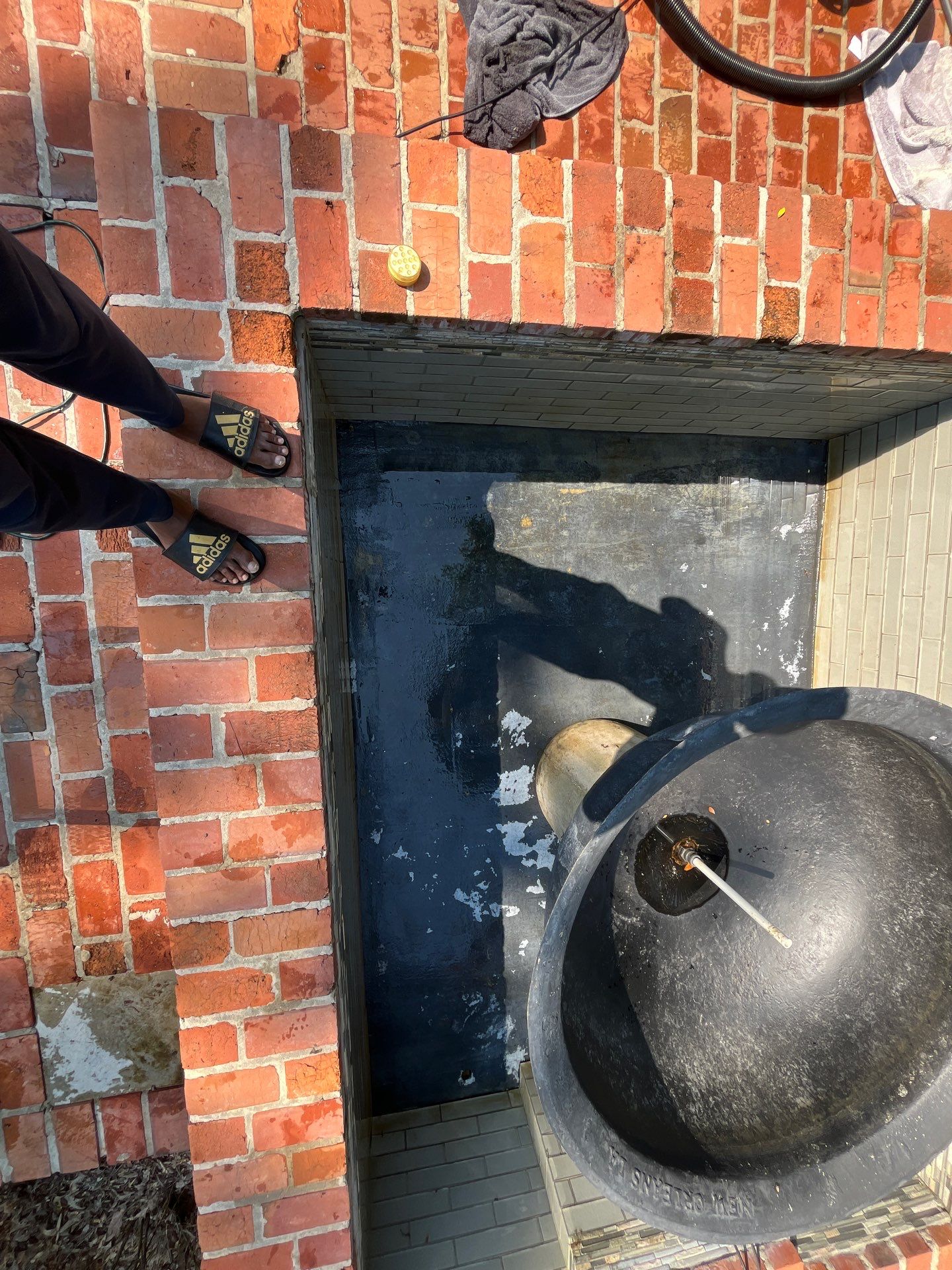 Pool Cleaning using Pool Cleaner by College Bros Outdoor services